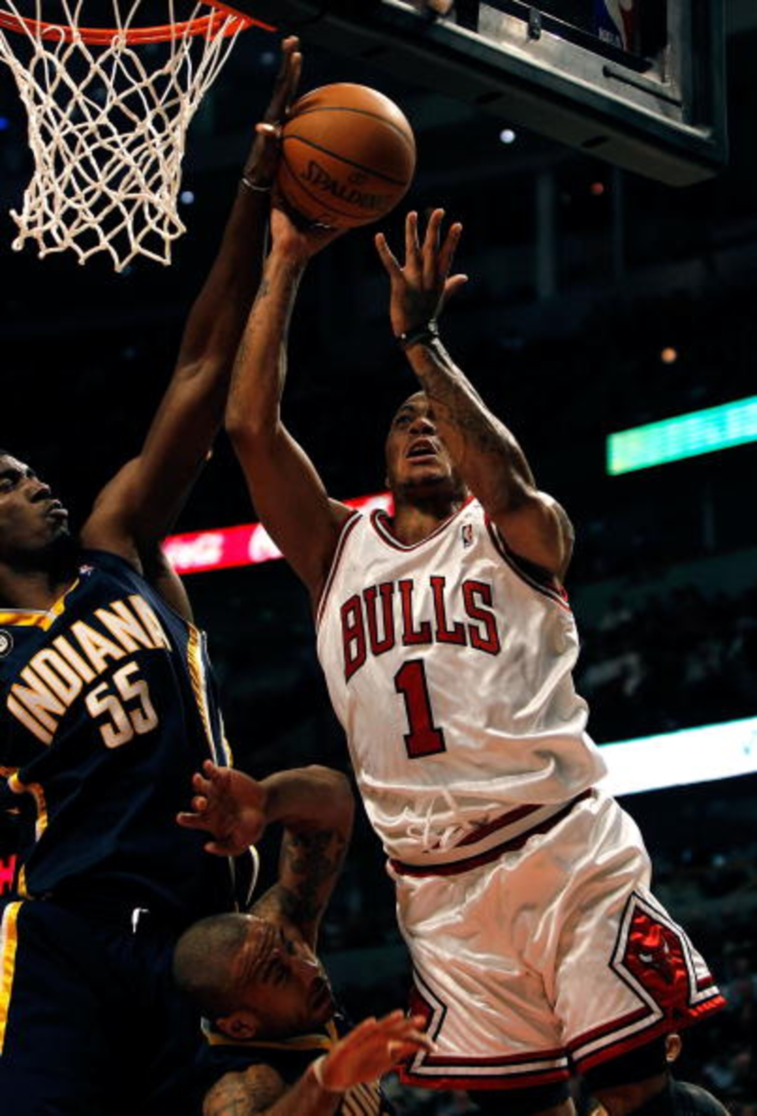 CHICAGO - FEBRUARY 24: Derrick Rose #1 of the Chicago Bulls goes up for a shot against Roy Hibbert #55 and Dahntay Jones #1 of the Indiana Pacers at the United Center on February 24, 2010 in Chicago, Illinois. The Bulls defeated the Pacers 120-110. NOTE T CHICAGO - FEBRUARY 24: Derrick Rose #1 of the Chicago Bulls goes up for a shot against Roy Hibbert #55 and Dahntay Jones #1 of the Indiana Pacers at the United Center on February 24, 2010 in Chicago, Illinois. The Bulls defeated the Pacers 120-110. NOTE T