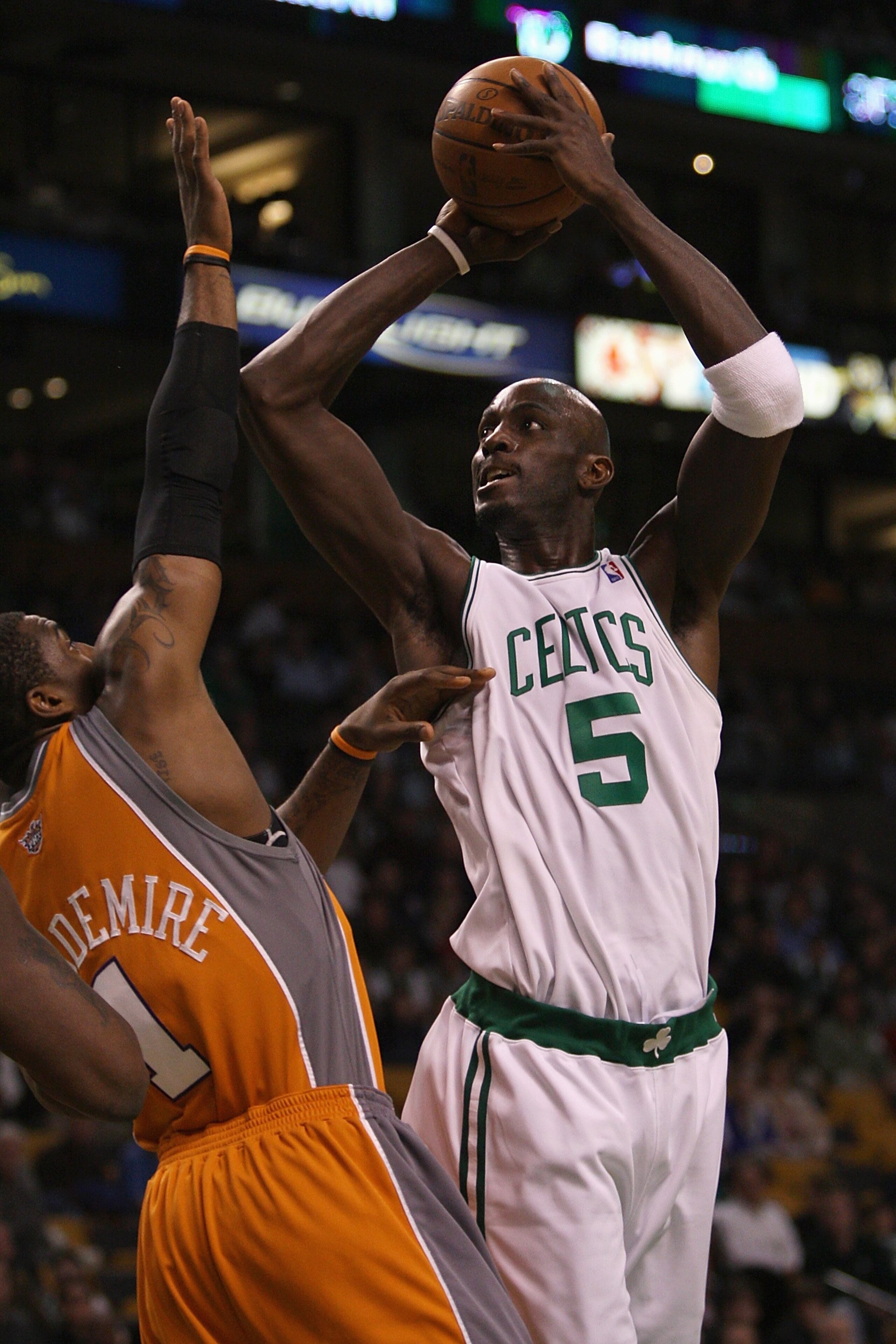 BOSTON - MARCH 26: Kevin Garnett #5 of the Boston Celtics puts up a shot against Amare Stoudemire #1 of the Phoenix Suns during the game on March 26, 2008 at the TD Banknorth Garden in Boston, Massachusetts. The Celtics won 117-97. NOTE TO USER: User exp BOSTON - MARCH 26: Kevin Garnett #5 of the Boston Celtics puts up a shot against Amare Stoudemire #1 of the Phoenix Suns during the game on March 26, 2008 at the TD Banknorth Garden in Boston, Massachusetts. The Celtics won 117-97. NOTE TO USER: User exp