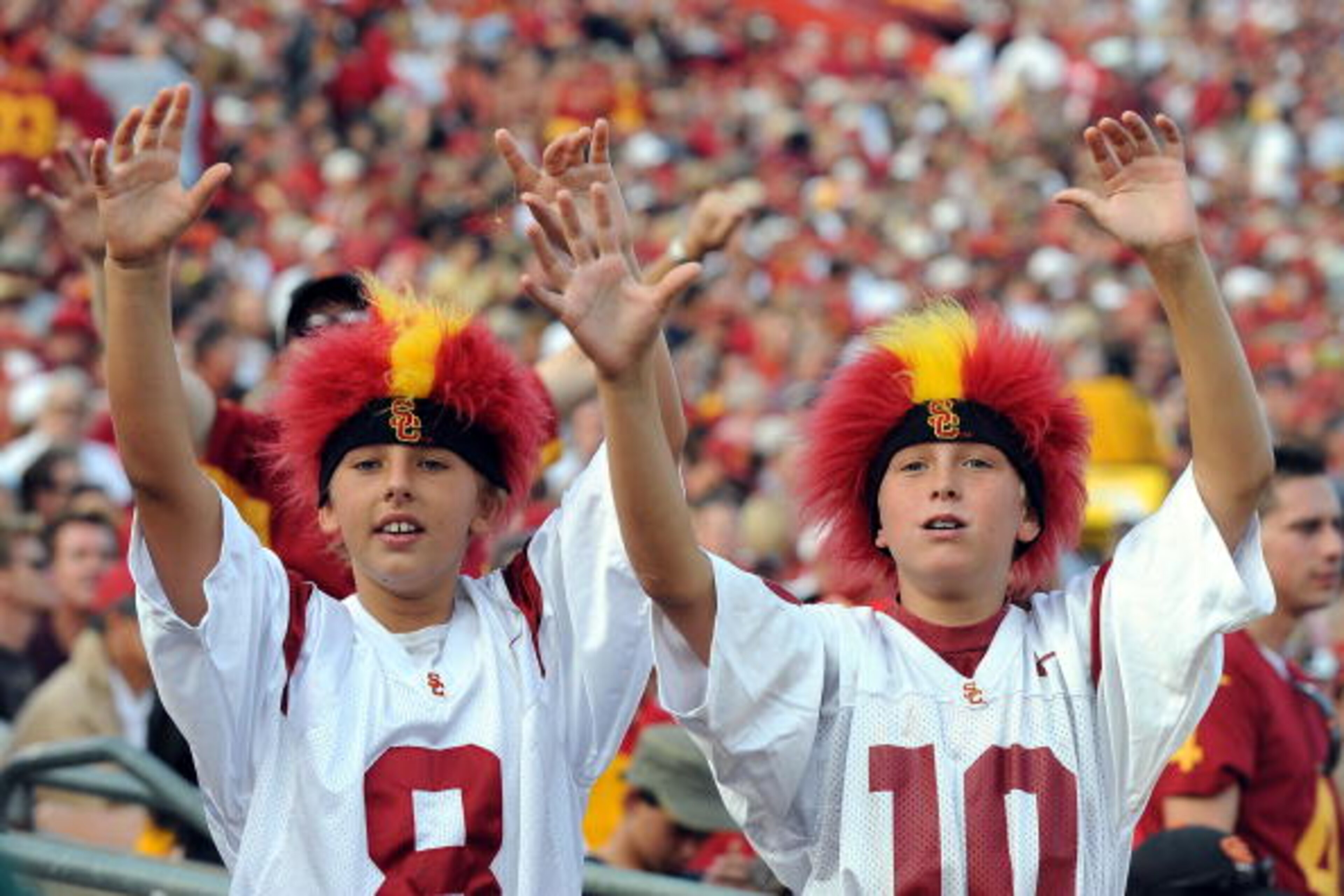 LOS ANGELES, CA - SEPTEMBER 13:  Fans of the USC Trojans cheer on their team while taking on the Ohio State Buckeyes during the college football game at the Los Angeles Memorial Coliseum on September 13, 2008 in Los Angeles, California.  (Photo by Harry H