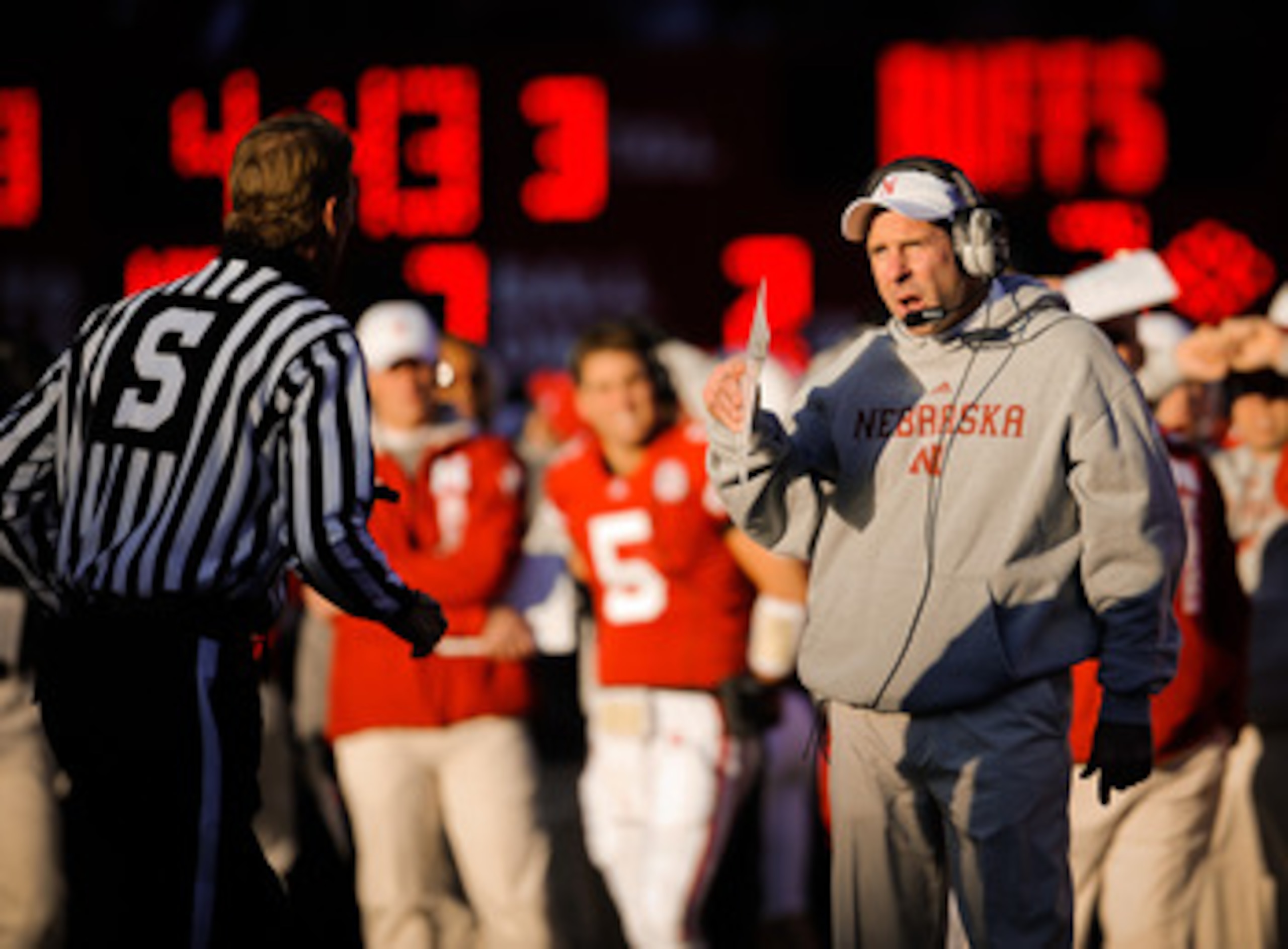 LINCOLN, NE - NOVEMBER 26: Coach Bo Pelini of the Nebraska Cornhuskers chats with a game official during their game against the Colorado Buffaloes at Memorial Stadium on November 26, 2010 in Lincoln, Nebraska. Nebraska defeated Colorado 45-17 (Photo by Er