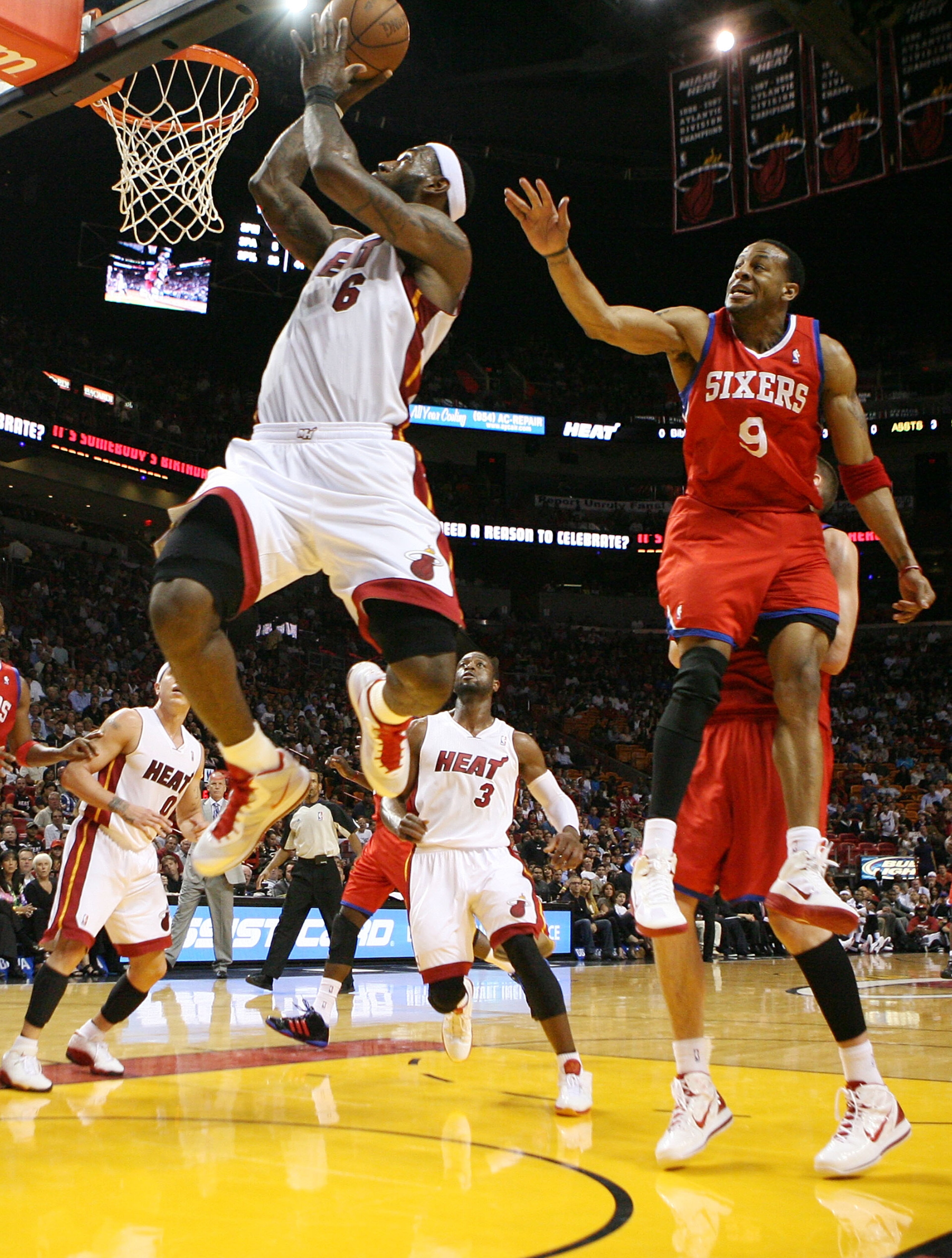 MIAMI, FL - MARCH 25:  LeBron James #6 of the Miami Heat dunks agains Guard Andre Iguodala #9 of the Philadelphia Sixers at American Airlines Arena on March 25, 2011 in Miami, Florida. NOTE TO USER: User expressly acknowledges and agrees that, by download