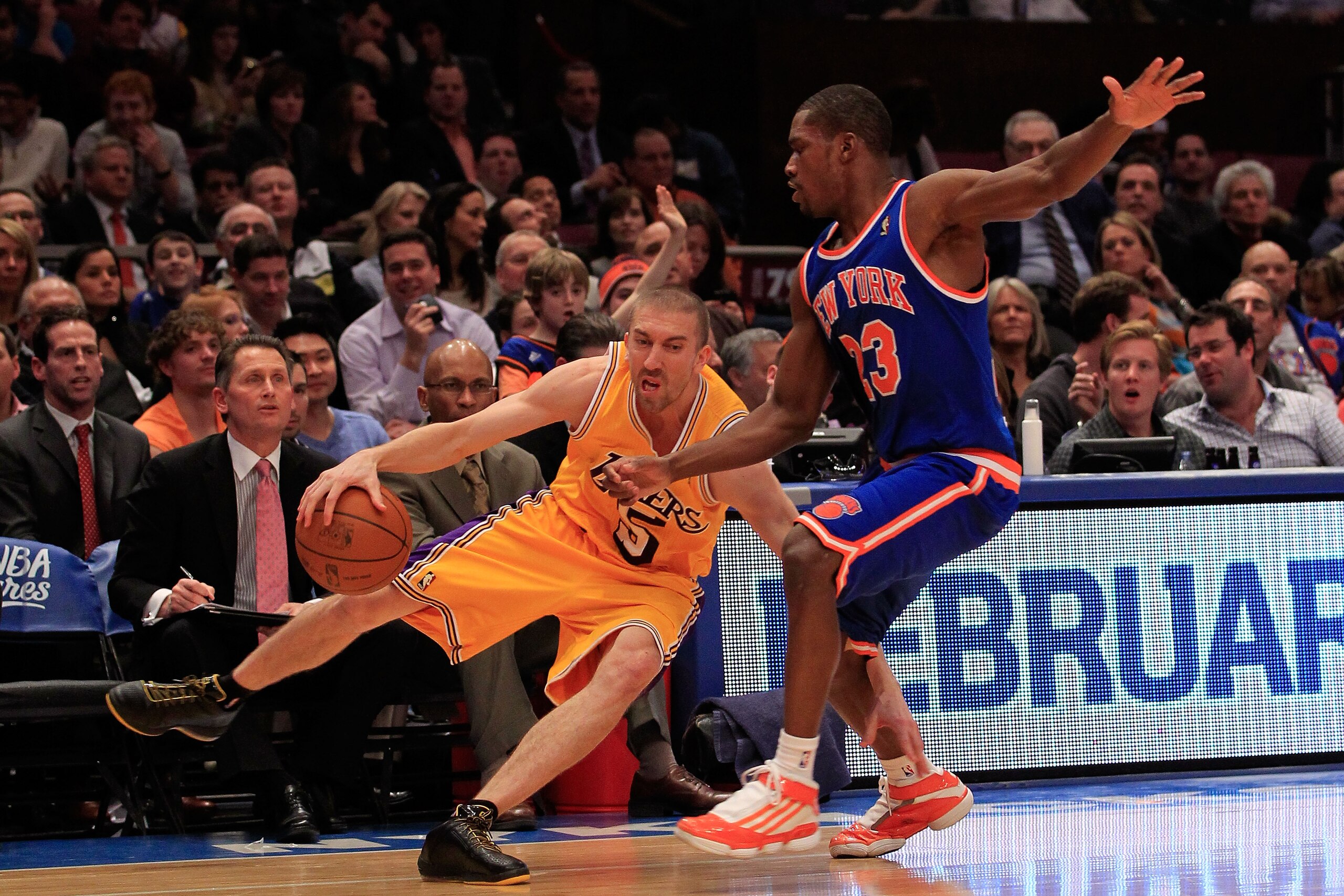 NEW YORK, NY - FEBRUARY 11: Steve Blake #5 of the Los Angeles Lakers drives against Toney Douglas #23 of the New York Knicks at Madison Square Garden on February 11, 2011 in New York City. NOTE TO USER: User expressly acknowledges and agrees that, by down