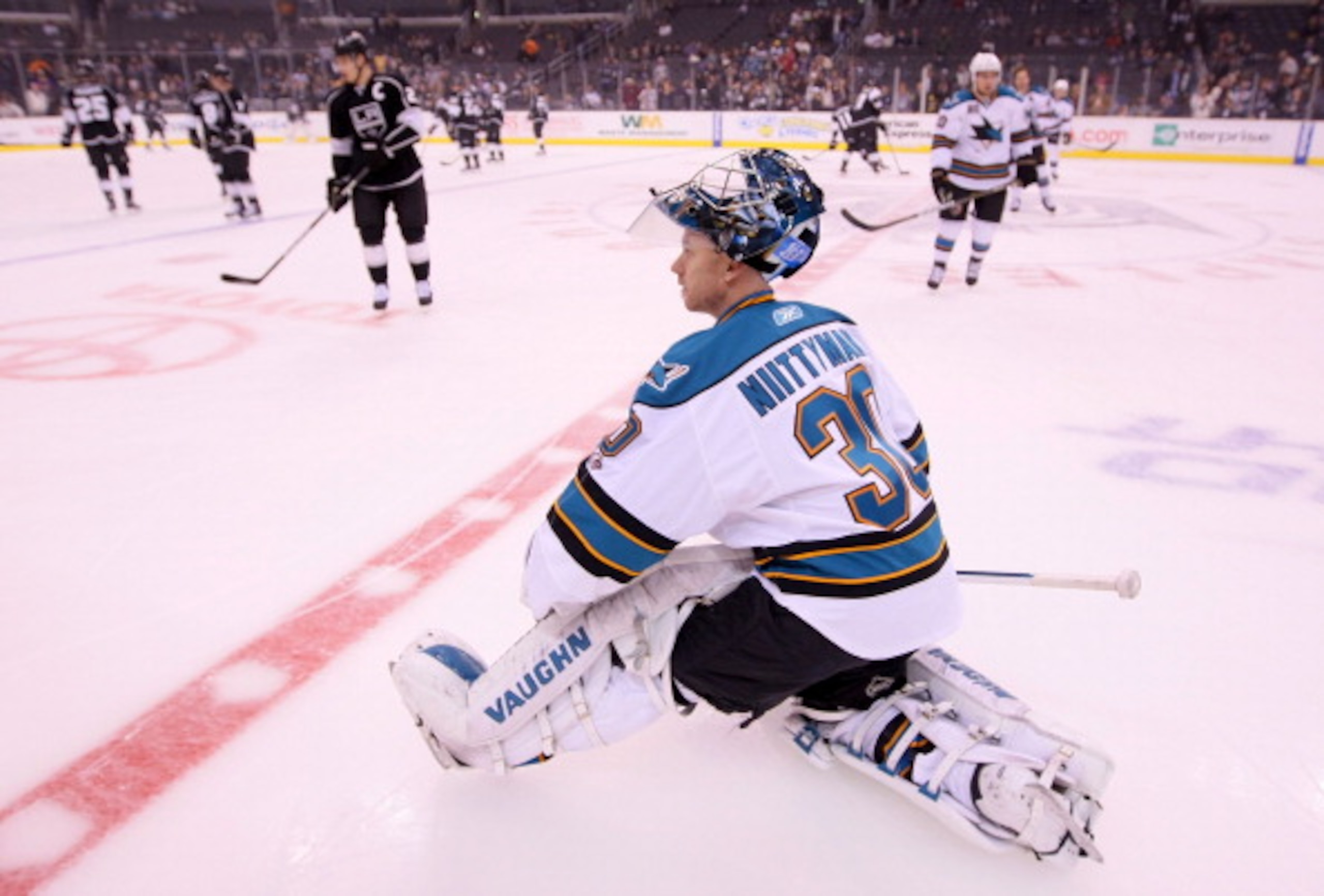 LOS ANGELES, CA - MARCH 24:  Goaltender Antero Niittymaki #30 of the San Jose Sharks stretches at center ice during warm-up prior to the NHL game against the Los Angeles Kings at Staples Center on March 24, 2011 in Los Angeles, California. The Kings defea