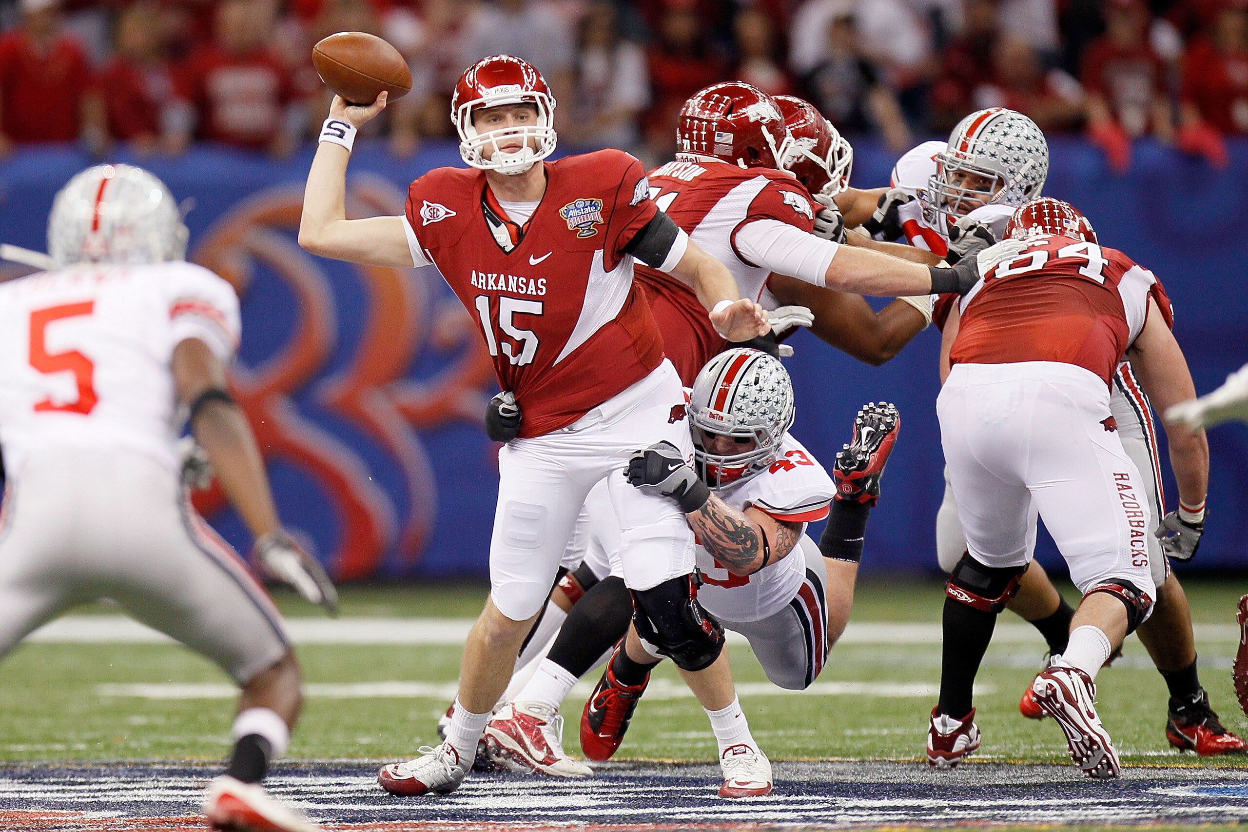 NEW ORLEANS, LA - JANUARY 04: Quarterback Ryan Mallett #15 of the Arkansas Razorbacks attempts to throw as Nathan Williams #43 of the Ohio State Buckeyes attempts to sack Mallett in the first half during the Allstate Sugar Bowl at the Louisiana Superdome NEW ORLEANS, LA - JANUARY 04: Quarterback Ryan Mallett #15 of the Arkansas Razorbacks attempts to throw as Nathan Williams #43 of the Ohio State Buckeyes attempts to sack Mallett in the first half during the Allstate Sugar Bowl at the Louisiana Superdome