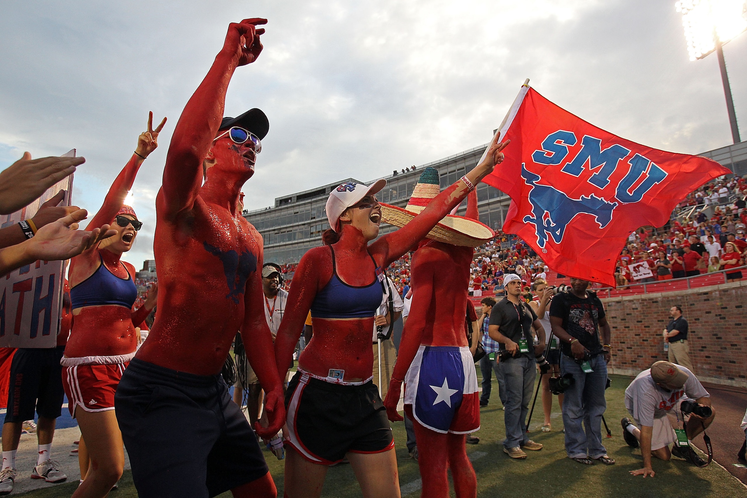 DALLAS - SEPTEMBER 24:  Fans of the SMU Mustangs wave a flag before a game against the TCU Horned Frogs at Gerald J. Ford Stadium on September 24, 2010 in Dallas, Texas.  (Photo by Ronald Martinez/Getty Images)