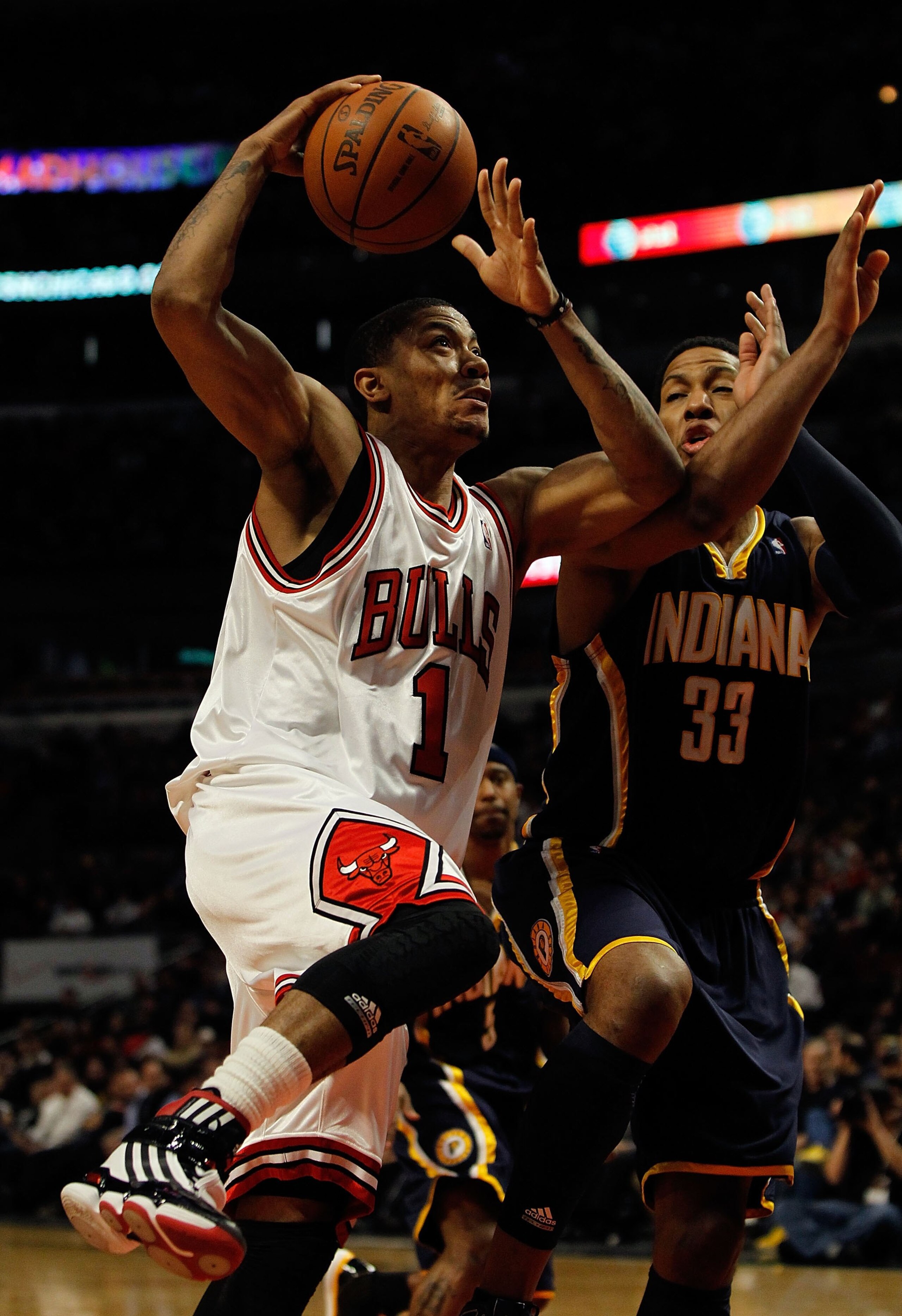 CHICAGO - FEBRUARY 24: Derrick Rose #1 of the Chicago Bulls drives to the basket against Danny Granger #33 of the Indiana Pacers at the United Center on February 24, 2010 in Chicago, Illinois. The Bulls defeated the Pacers 120-110. NOTE TO USER: User expr