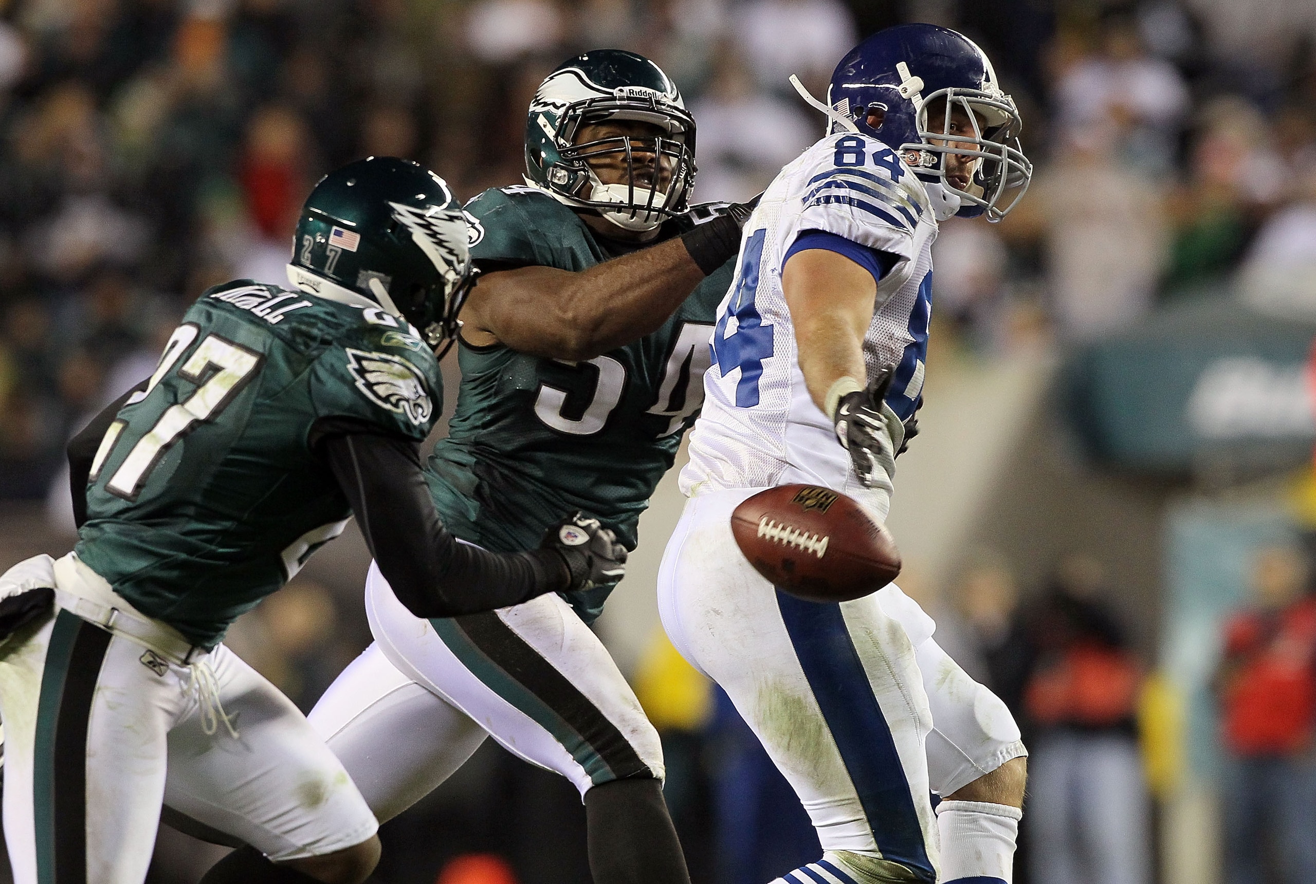PHILADELPHIA - NOVEMBER 07:  Jacob Tamme #84 of the Indianapolis Colts can not come up with a pass as he is defended by Brandon Graham #54 and Quintin Mickell #27 of the Philadelphia Eagles on November 7, 2010 at Lincoln Financial Field in Philadelphia, P