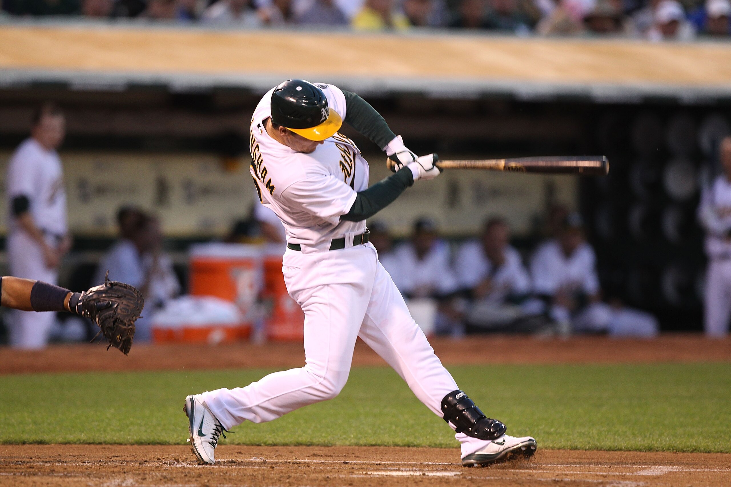 OAKLAND, CA - APRIL 01:  Josh Willingham #16 of the Oakland Athletics hits a two run home run in the first inning against the Seattle Mariners during an opening day game of Major League Baseball at the Oakland-Alameda County Coliseum on April 1, 2011 in O