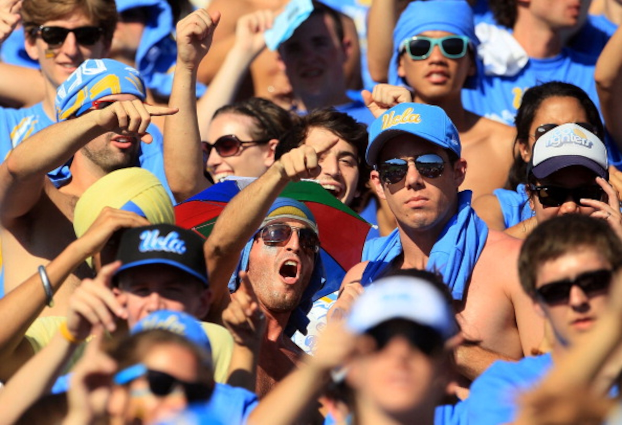 PASADENA, CA - OCTOBER 02:  Fans of the UCLA Bruins cheer on their team as they play the Washington State Cougars at the Rose Bowl on October 2, 2010 in Pasadena, California.  (Photo by Jeff Gross/Getty Images)