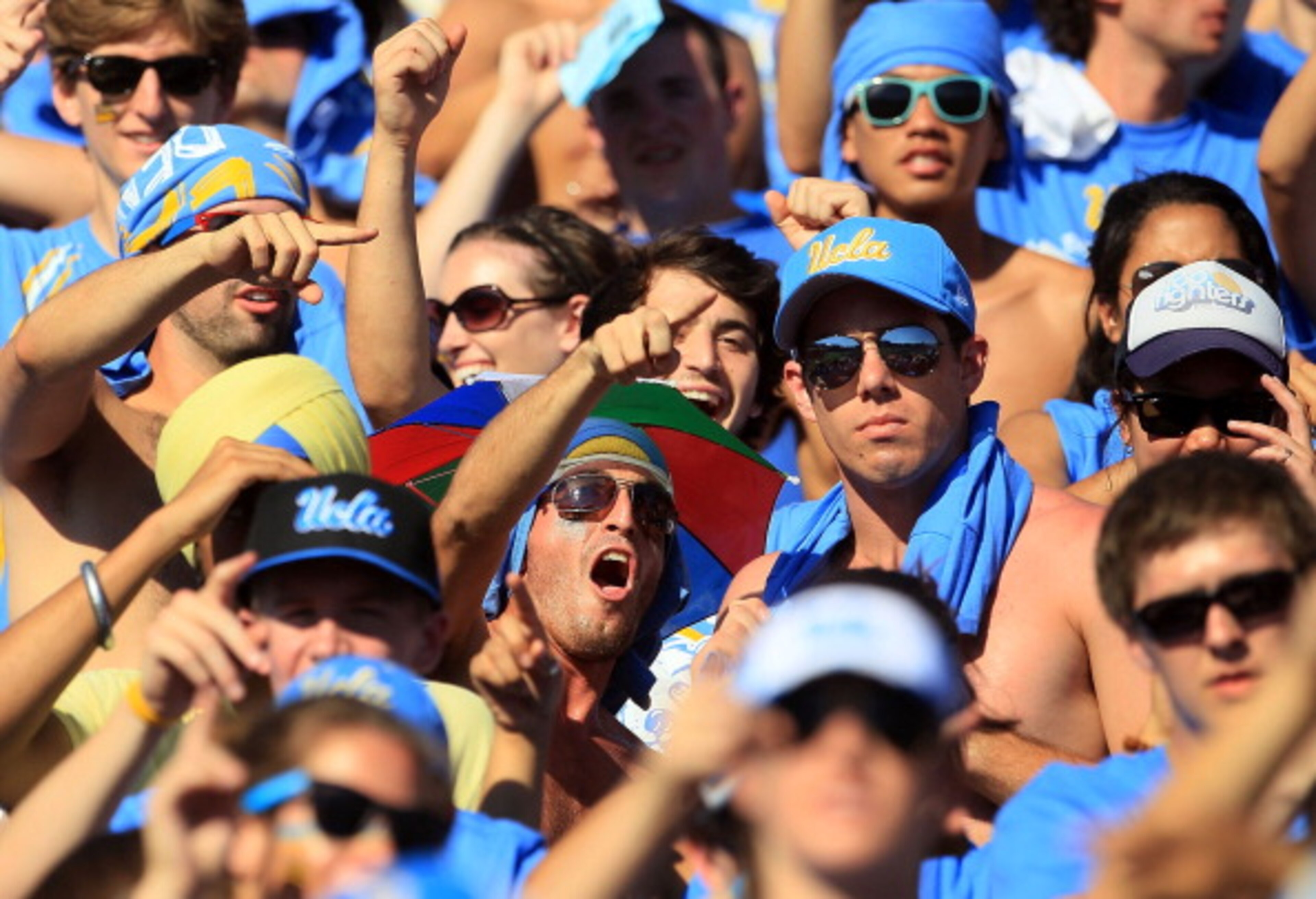 PASADENA, CA - OCTOBER 02:  Fans of the UCLA Bruins cheer on their team as they play the Washington State Cougars at the Rose Bowl on October 2, 2010 in Pasadena, California.  (Photo by Jeff Gross/Getty Images)