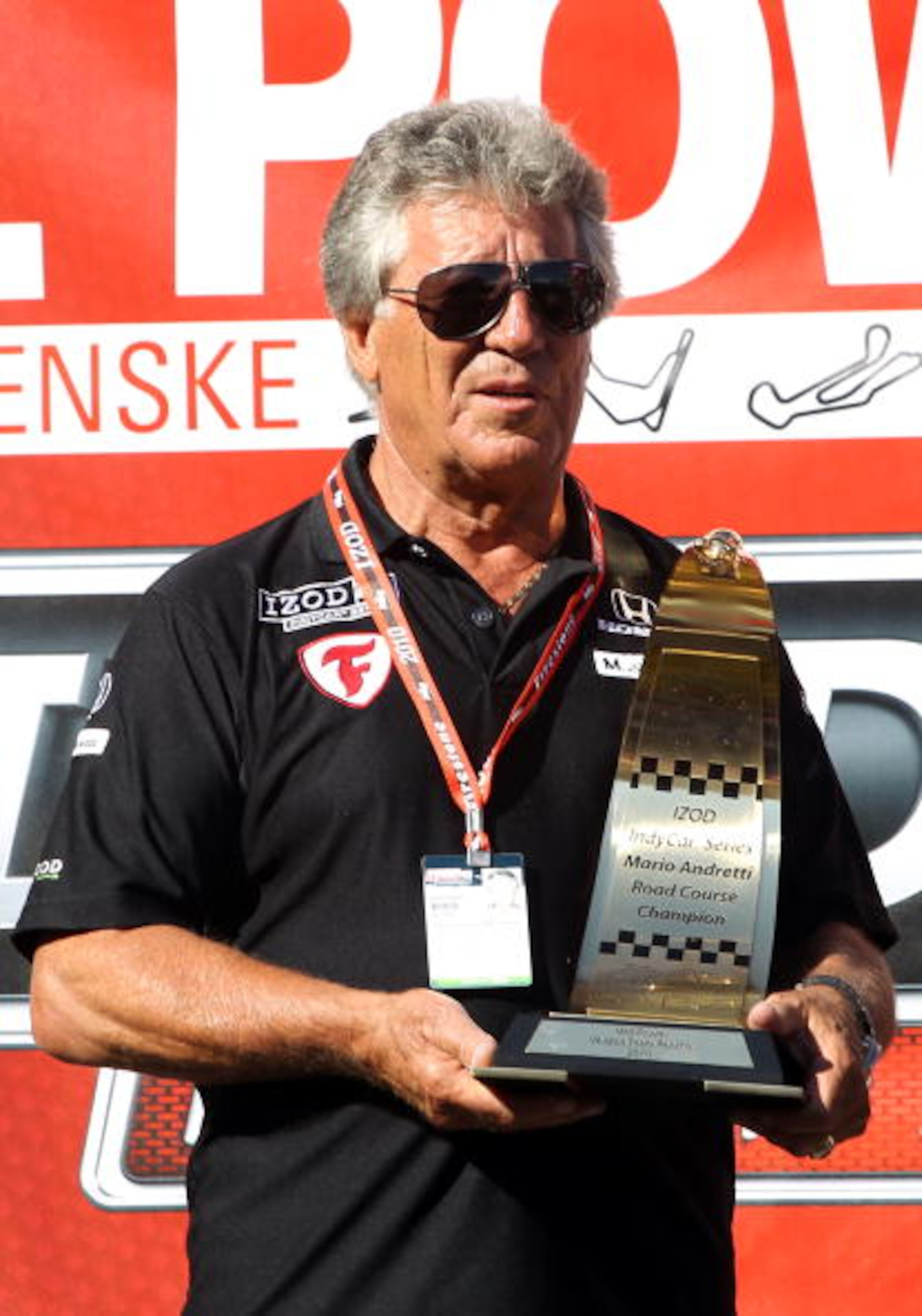 SONOMA, CA - AUGUST 22:   Mario Andretti stands with Road Championship Trophy after the IZOD IndyCar Series Grand Prix of Sonoma at Infineon Raceway on August 22, 2010 in Sonoma, California.  (Photo by Christian Petersen/Getty Images)