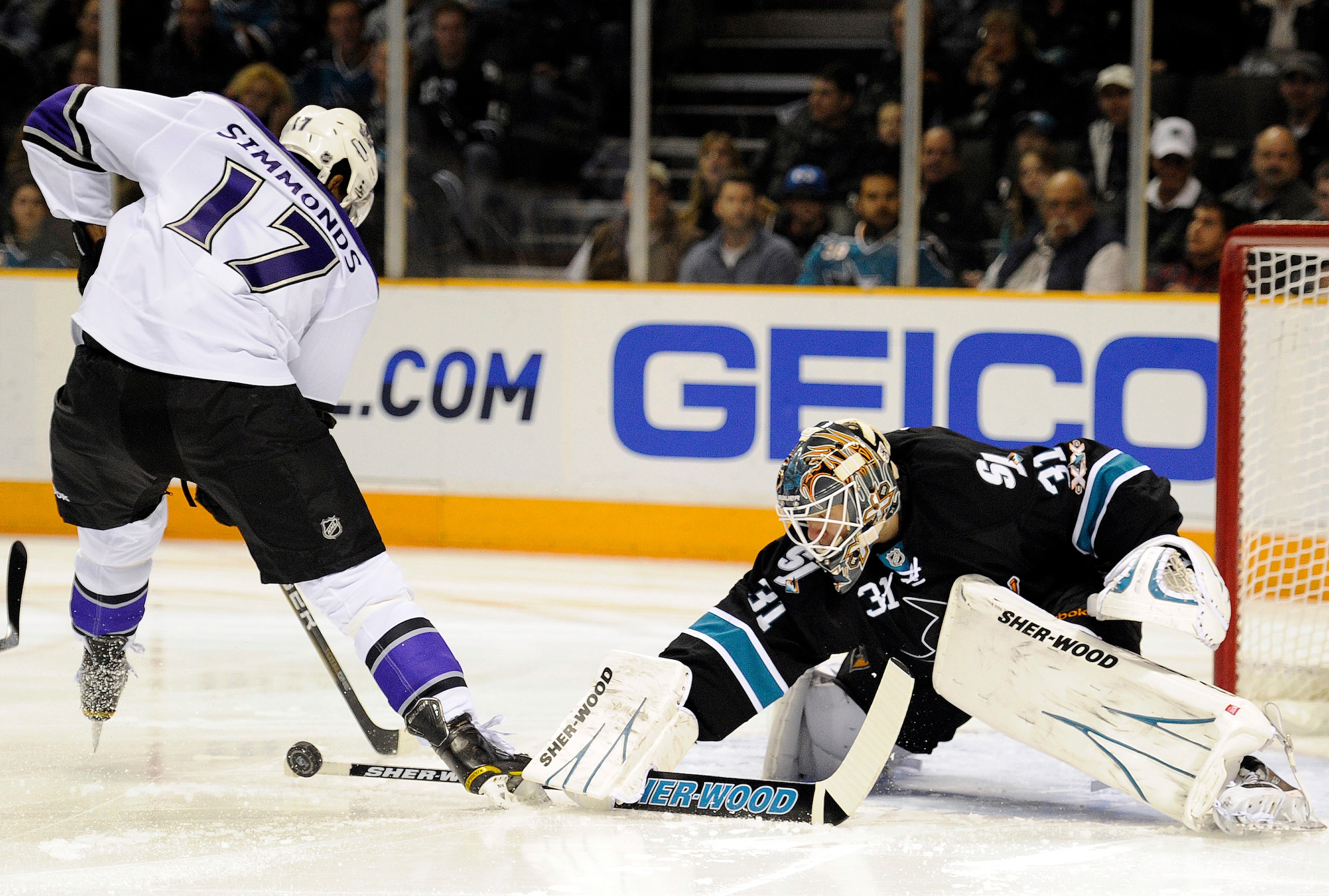 SAN JOSE, CA - DECEMBER 27:  Goalie Antti Niemi #31of the San Jose Sharks makes a save on the shot of Wayne Simmonds #17 of the Los Angeles Kings during an NHL hockey game at the HP Pavilion on December 27, 2010 in San Jose, California. (Photo by Thearon
