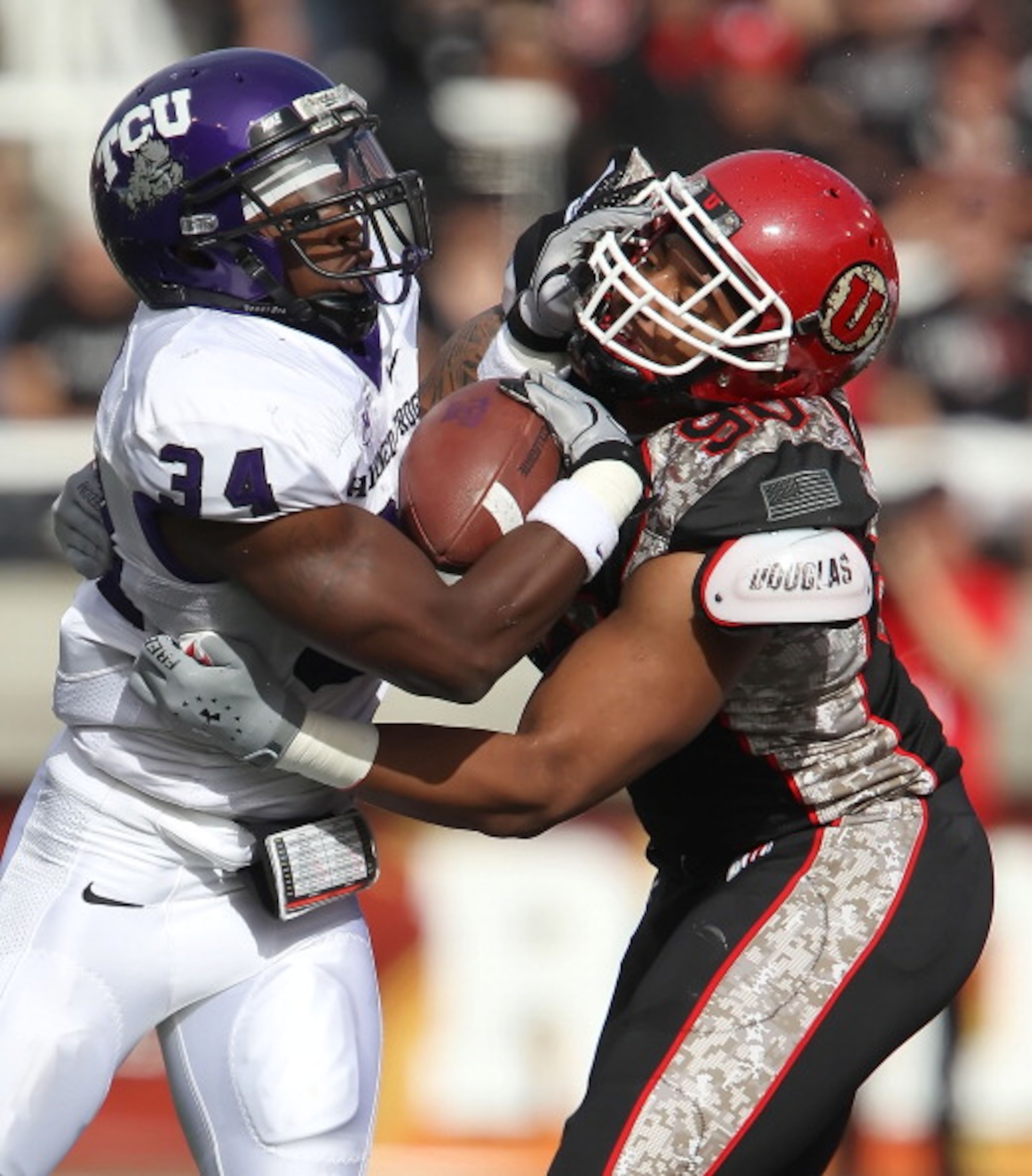 SALT LAKE CITY, UT - NOVEMBER 6: Derrick Shelby #90 of the Utah Utes hits Ed Wesley #34 of the TCU Horned Frogs during the first half of an NCAA football game November 6, 2010 at Rice-Eccles Stadium in Salt Lake City, Utah. (Photo by George Frey/Getty Ima