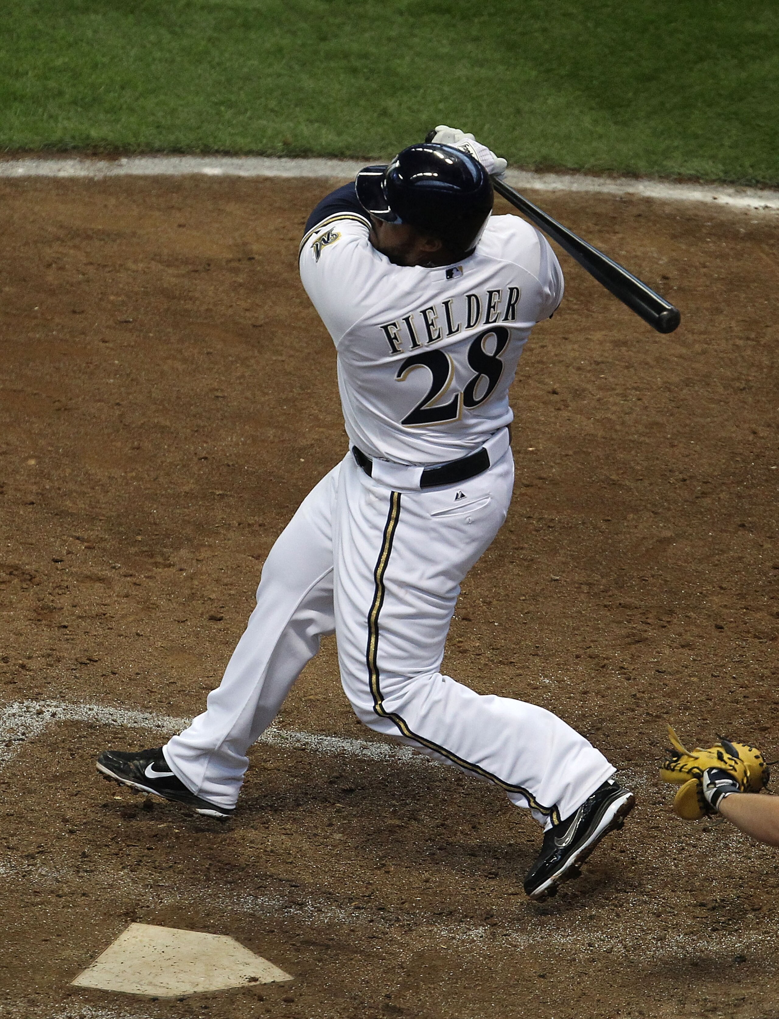 MILWAUKEE, WI - APRIL 04: Prince Fielder #28 of the Milwaukee Brewers hits the ball against the Atlanta Braves during the home opener at Miller Park on April 4, 2011 in Milwaukee, Wisconsin. The Braves defeated the Brewers 2-1. (Photo by Jonathan Daniel/G