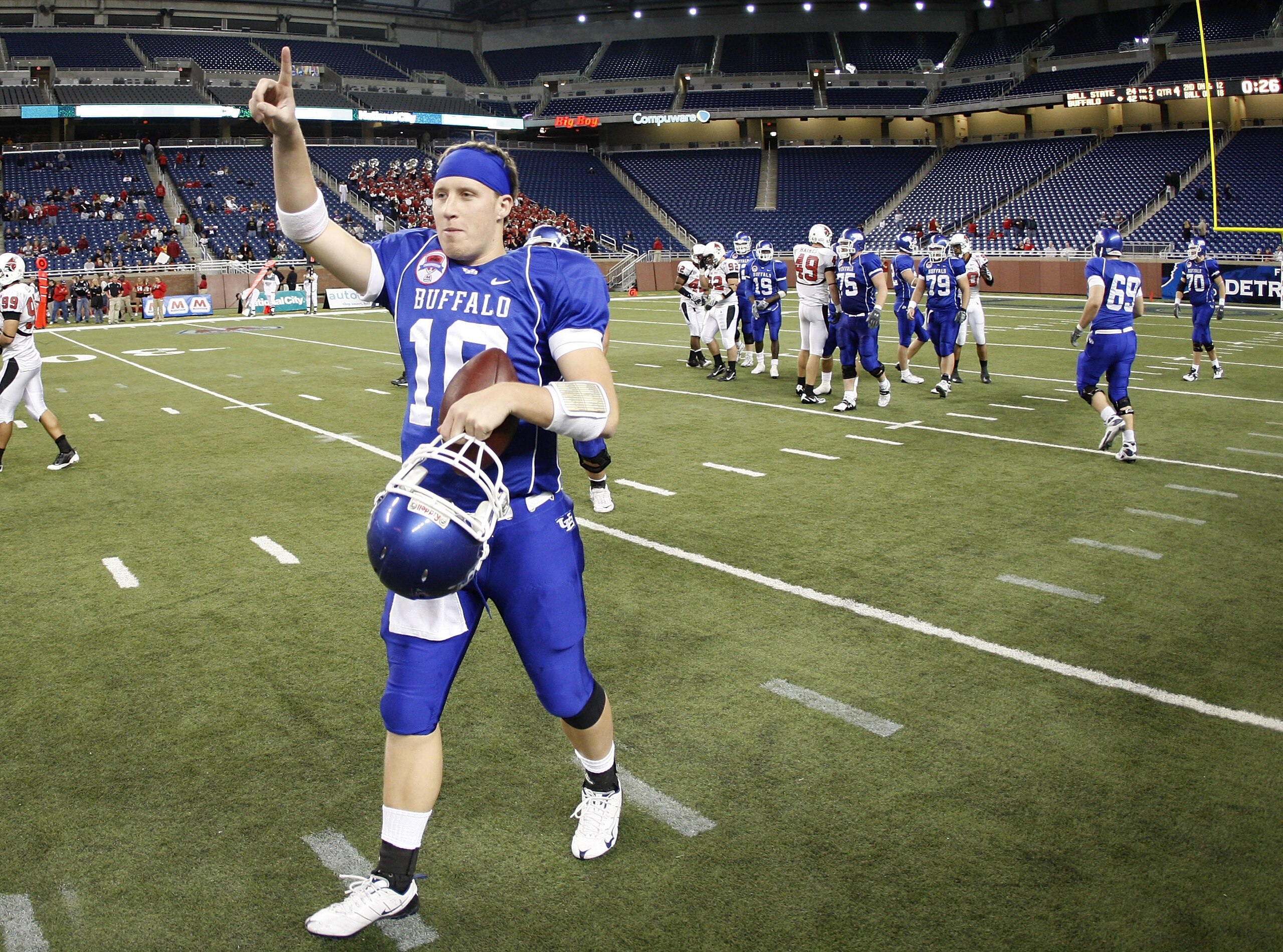 DETROIT - DECEMBER 05: Drew Willy #16 of the Buffalo Bulls celebrates with teammates the MAC Championship after defeating the Ball State Cardinals on December 5, 2008 at Ford Field in Detroit, Michigan. (Photo by Gregory Shamus/Getty Images)
