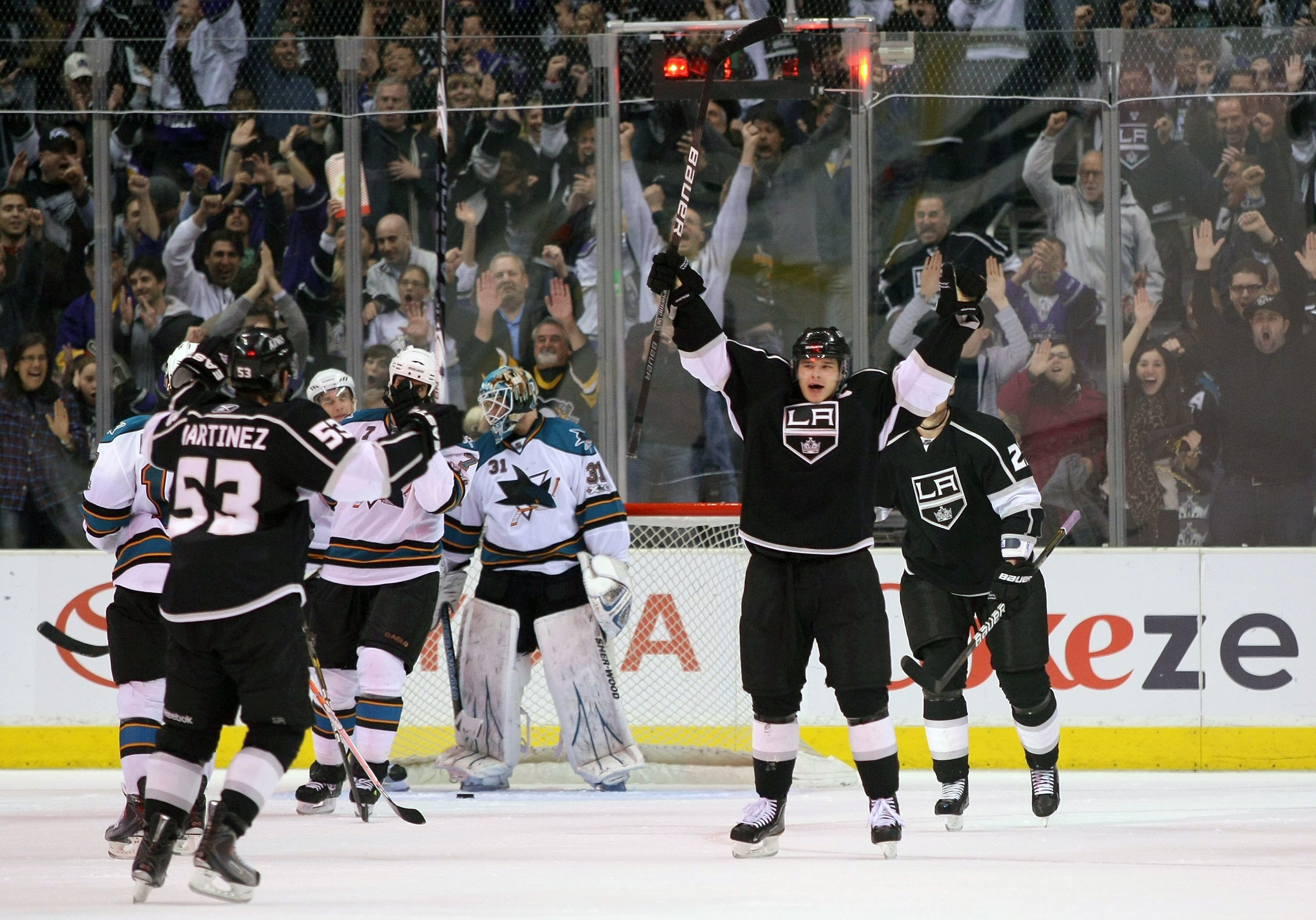 LOS ANGELES, CA - MARCH 24:  Dustin Brown #23 of the Los Angeles Kings reacts after scoring against goaltender Antti Niemi #31 of the San Jose Sharks in the third period during the NHL game at Staples Center on March 24, 2011 in Los Angeles, California. T