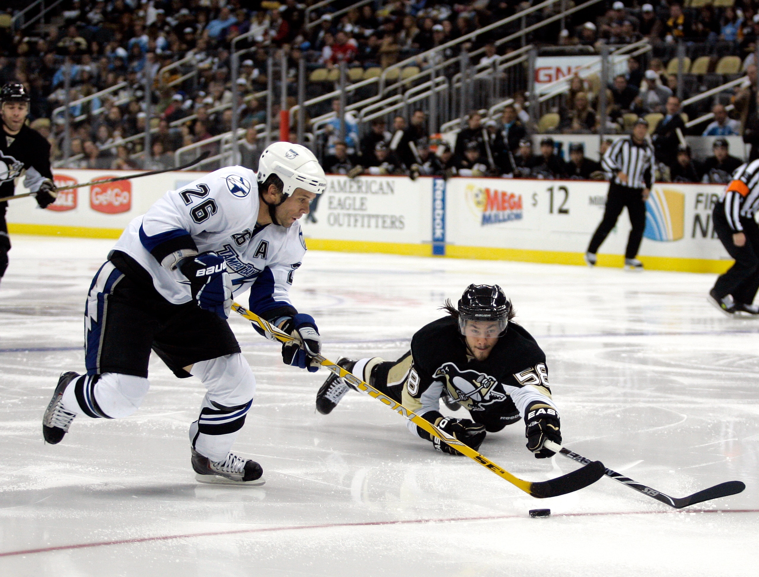PITTSBURGH - NOVEMBER 12: Martin St. Louis #26 of the Tampa Bay Lightning handles the puck around Kris Letang #58 of the Pittsburgh Penguins at Consol Energy Center on November 12, 2010 in Pittsburgh, Pennsylvania. (Photo by Justin K. Aller/Getty Images PITTSBURGH - NOVEMBER 12: Martin St. Louis #26 of the Tampa Bay Lightning handles the puck around Kris Letang #58 of the Pittsburgh Penguins at Consol Energy Center on November 12, 2010 in Pittsburgh, Pennsylvania. (Photo by Justin K. Aller/Getty Images