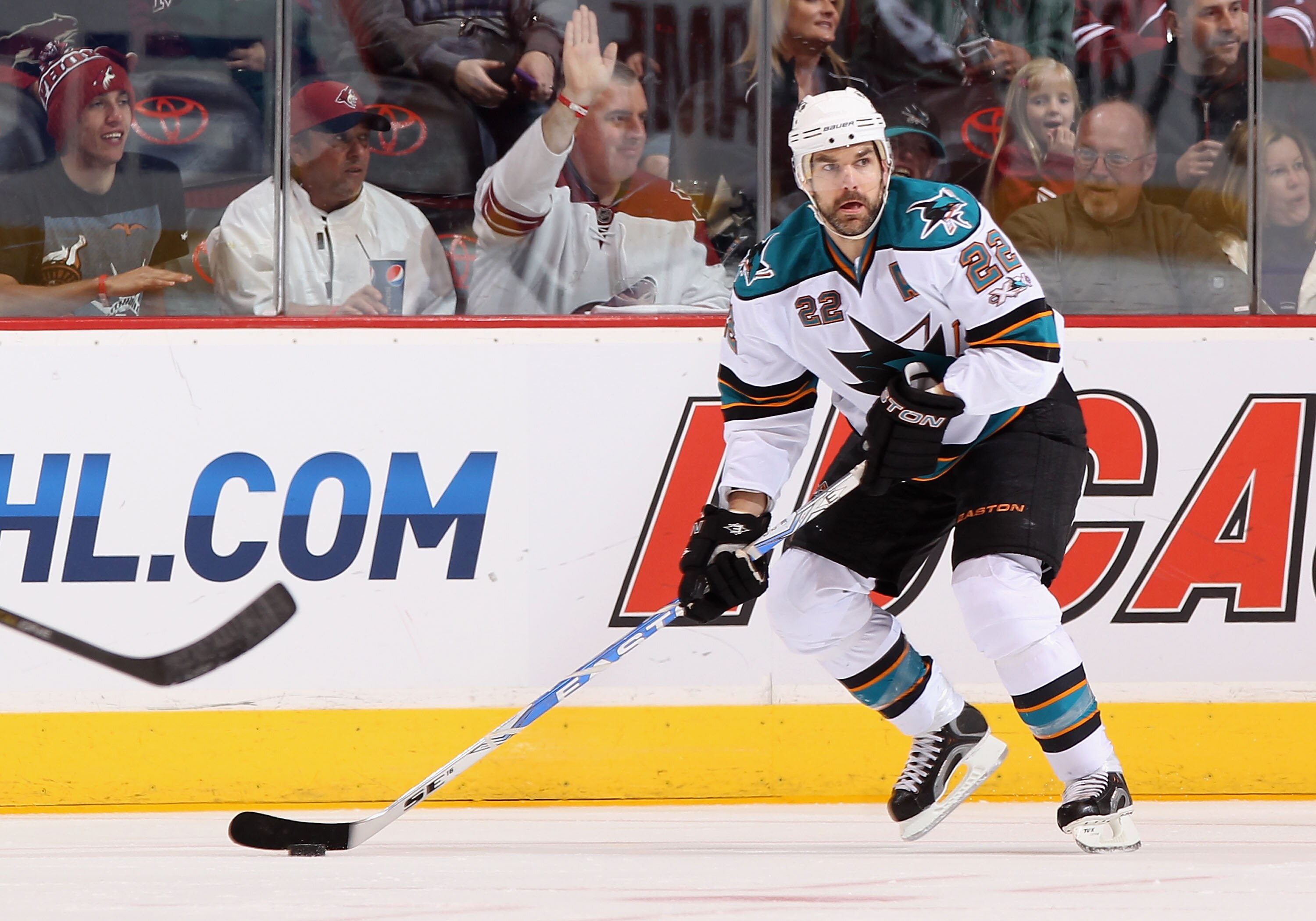 GLENDALE, AZ - MARCH 26:  Dan Boyle #22 of the San Jose Sharks skates with the puck during the NHL game against the Phoenix Coyotes at Jobing.com Arena on March 26, 2011 in Glendale, Arizona. The Sharks defeated the Coyotes 4-1.  (Photo by Christian Peter