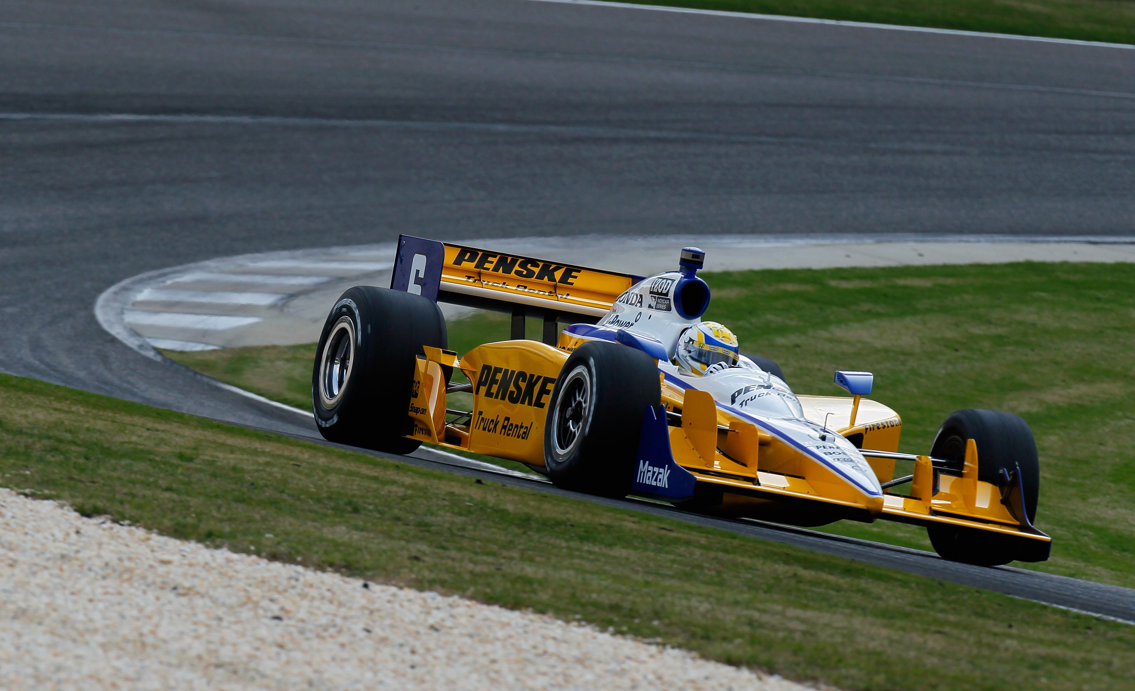 BIRMINGHAM, AL - APRIL 08:  Ryan Briscoe of Australia, driver of the #6 Team Penske Dallara Honda, drives during practice for the IndyCar Series Honda Indy Grand Prix of Alabama at Barber Motorsports Park on April 8, 2011 in Birmingham, Alabama.  (Photo b