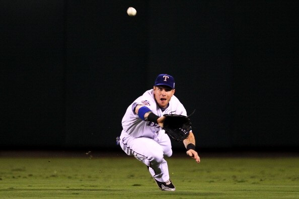 ARLINGTON, TX - OCTOBER 31:  Josh Hamilton #32 of the Texas Rangers makes a diving catch in the second inning against the San Francisco Giants in Game Four of the 2010 MLB World Series at Rangers Ballpark in Arlington on October 31, 2010 in Arlington, Tex