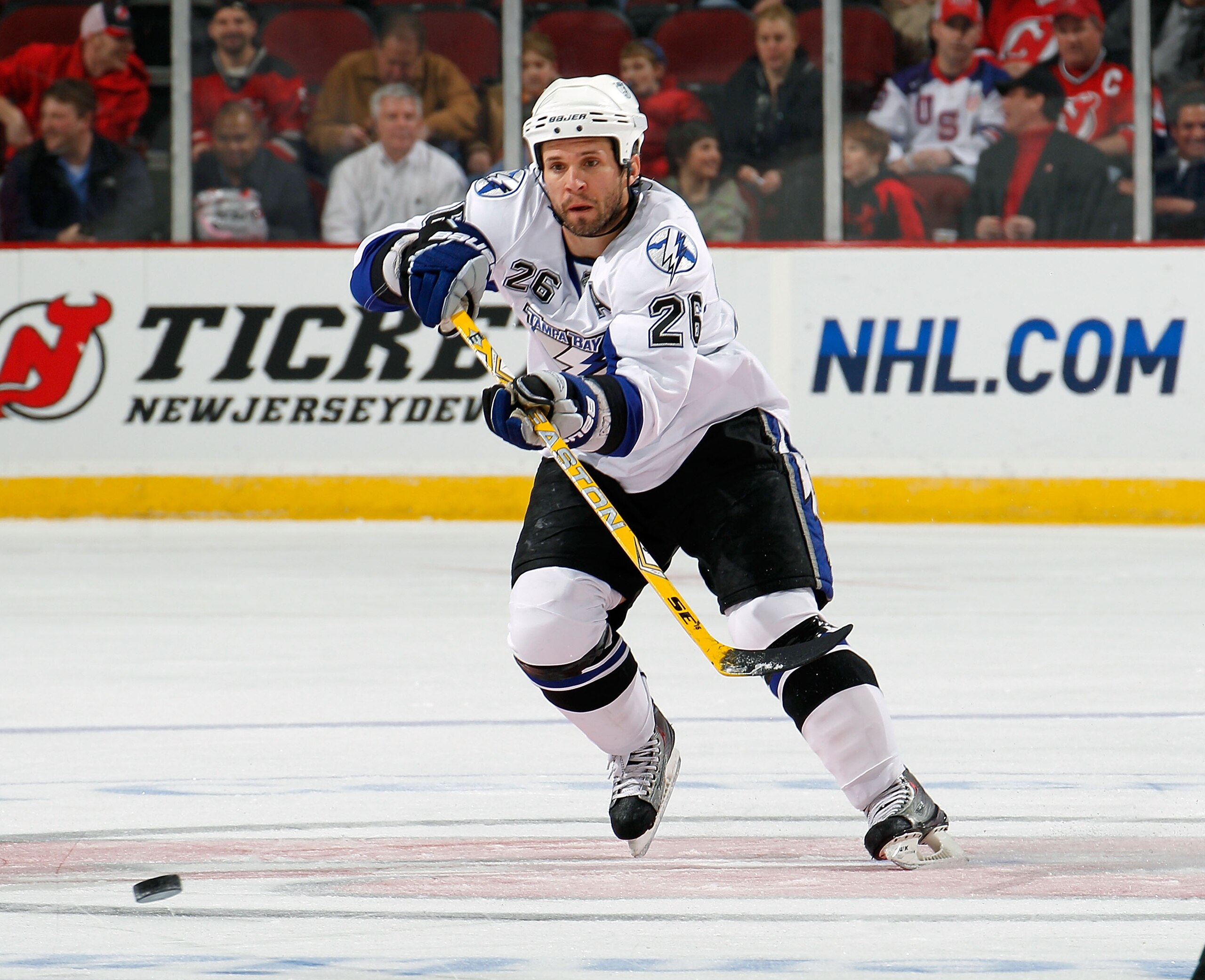 NEWARK, NJ - MARCH 02: Martin St. Louis #26 of the Tampa Bay Lightning passes during an NHL hockey game against the New Jersey Devils at the Prudential Center on March 2, 2011 in Newark, New Jersey. (Photo by Paul Bereswill/Getty Images) NEWARK, NJ - MARCH 02: Martin St. Louis #26 of the Tampa Bay Lightning passes during an NHL hockey game against the New Jersey Devils at the Prudential Center on March 2, 2011 in Newark, New Jersey. (Photo by Paul Bereswill/Getty Images)