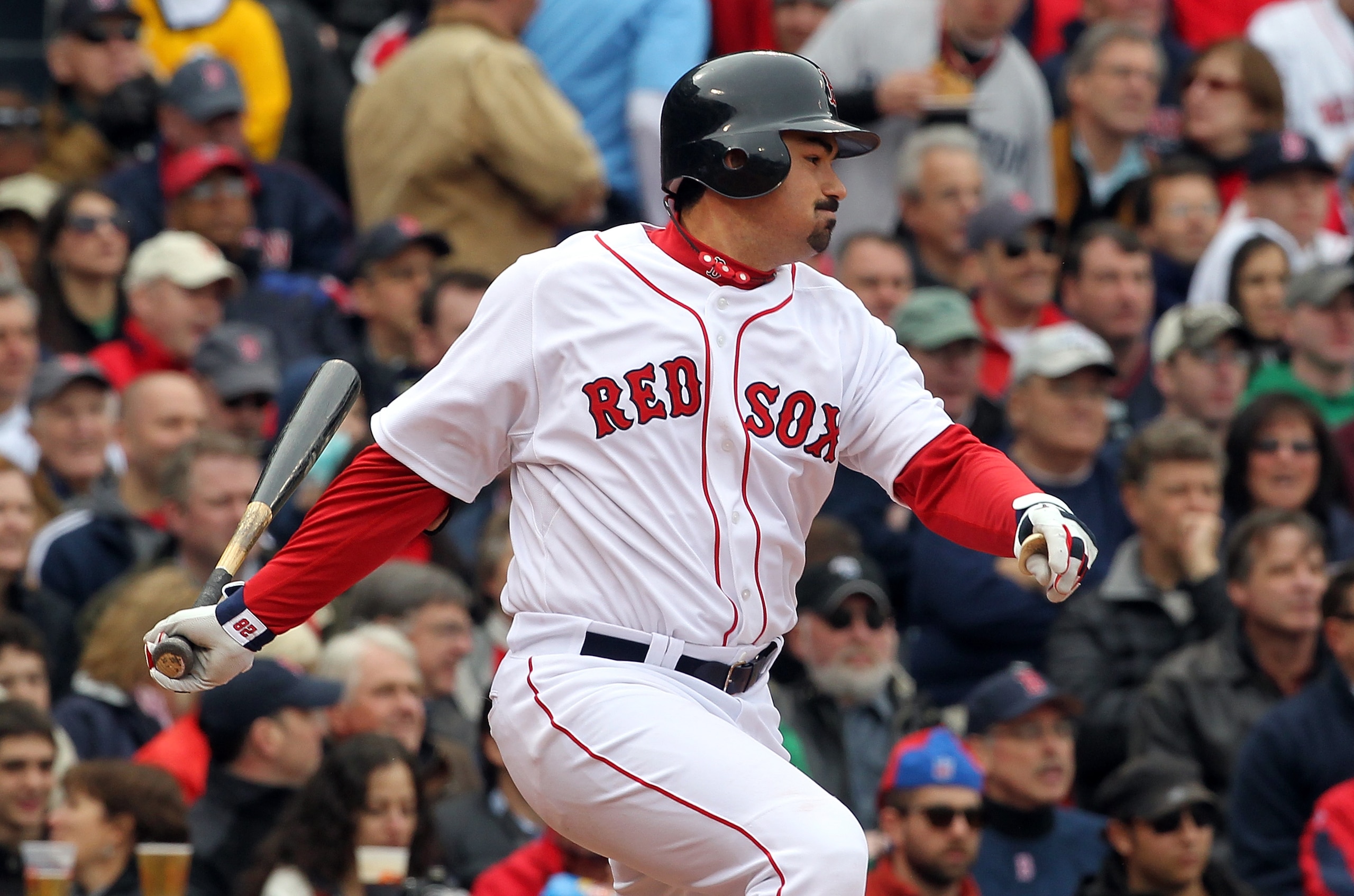 BOSTON, MA - APRIL 8:   Adrian Gonzalez #28 of the Boston Red Sox knocks in a run in the second inning against the New York Yankees on Opening Day at Fenway Park on April 8, 2011 in Boston, Massachusetts. (Photo by Jim Rogash/Getty Images)