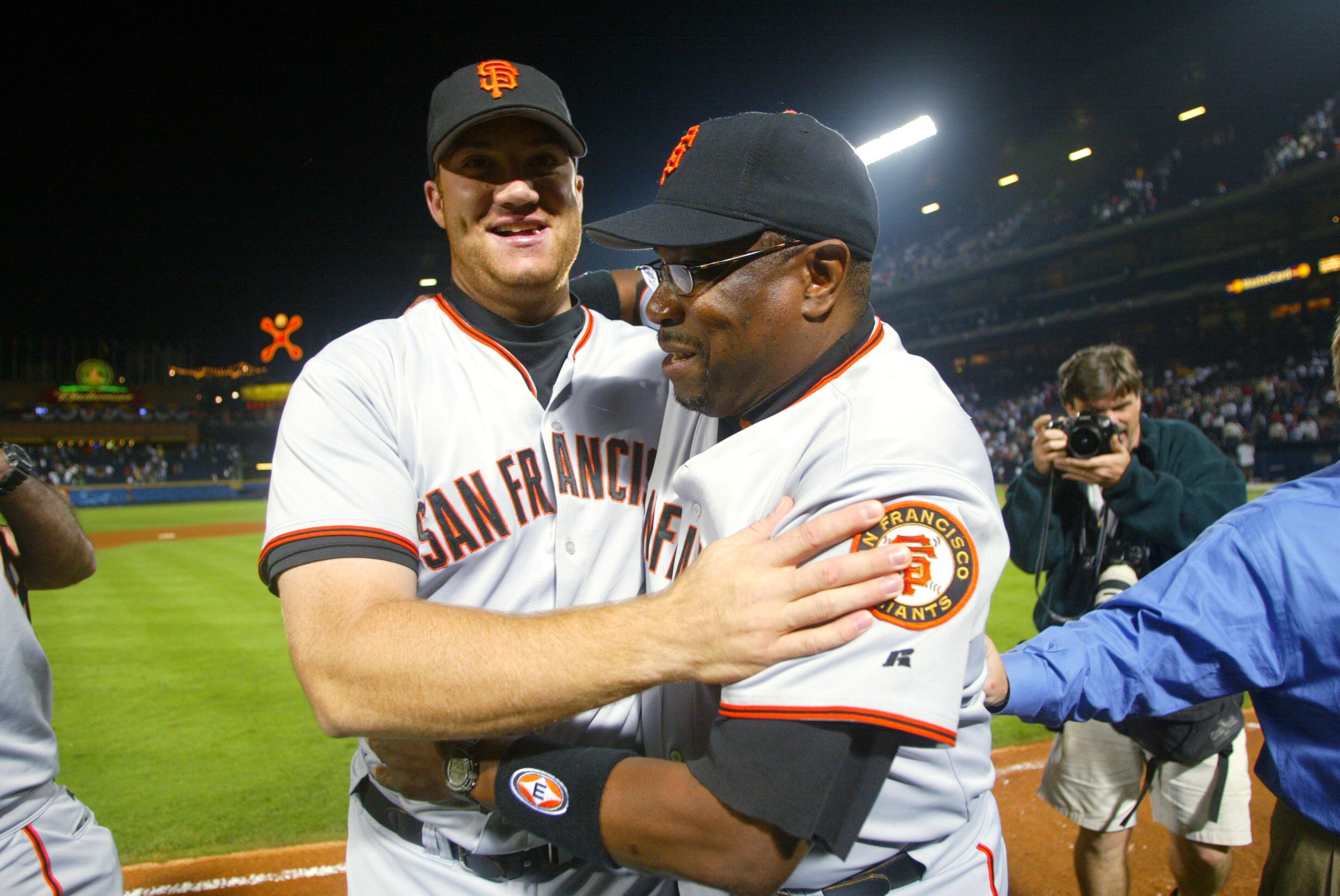 ATLANTA - OCTOBER 7:  First baseman Damon Minor #37 of the San Francisco Giants hugs manager Dusty Baker after winning game five of the National League Division Series against the Atlanta Braves on October 7, 2002  at Turner Field in Atlanta, Georgia.  Th