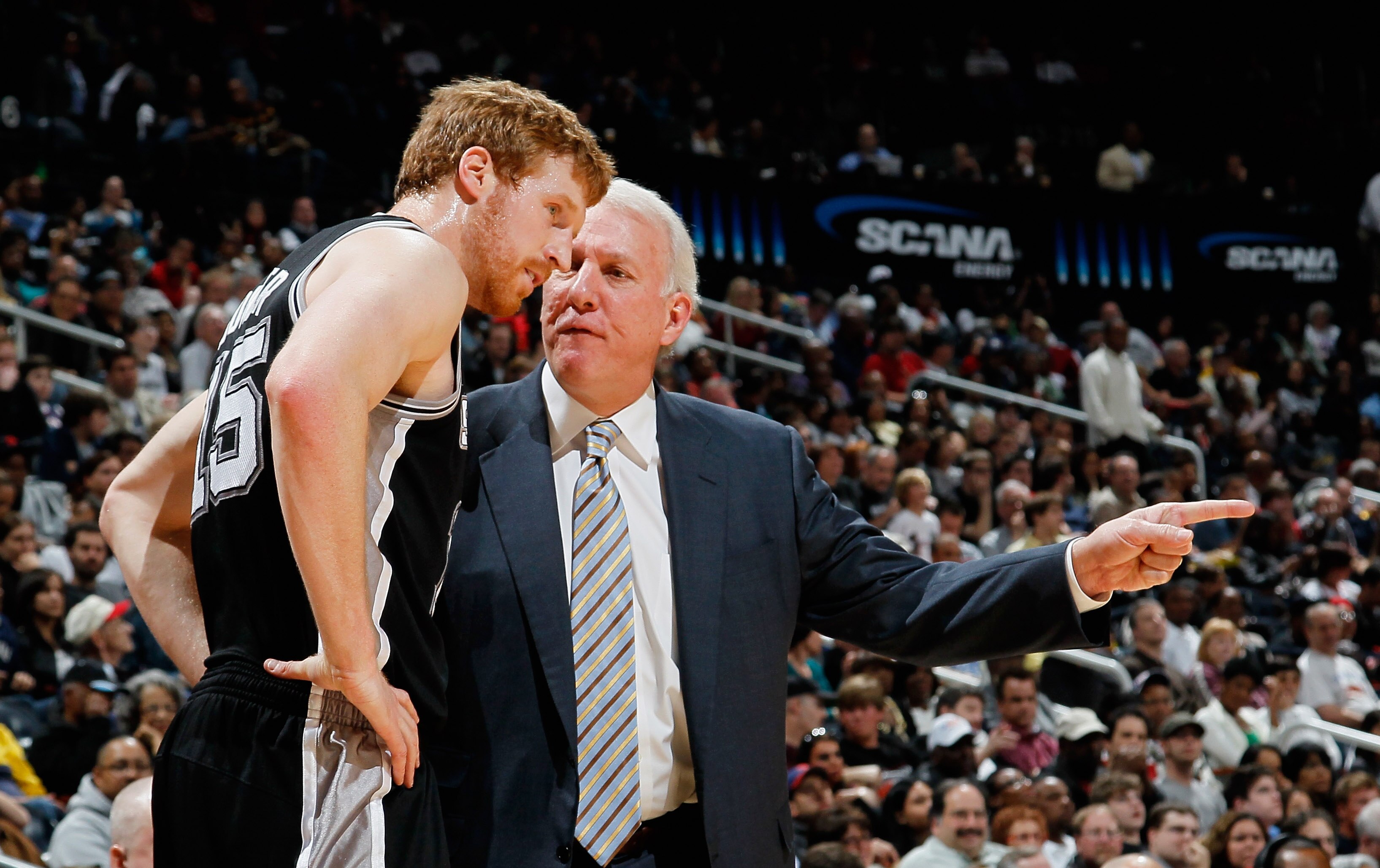 ATLANTA, GA - APRIL 05:  Matt Bonner #15 and head coach Gregg Popovich of the San Antonio Spurs against the Atlanta Hawks at Philips Arena on April 5, 2011 in Atlanta, Georgia.  NOTE TO USER: User expressly acknowledges and agrees that, by downloading and