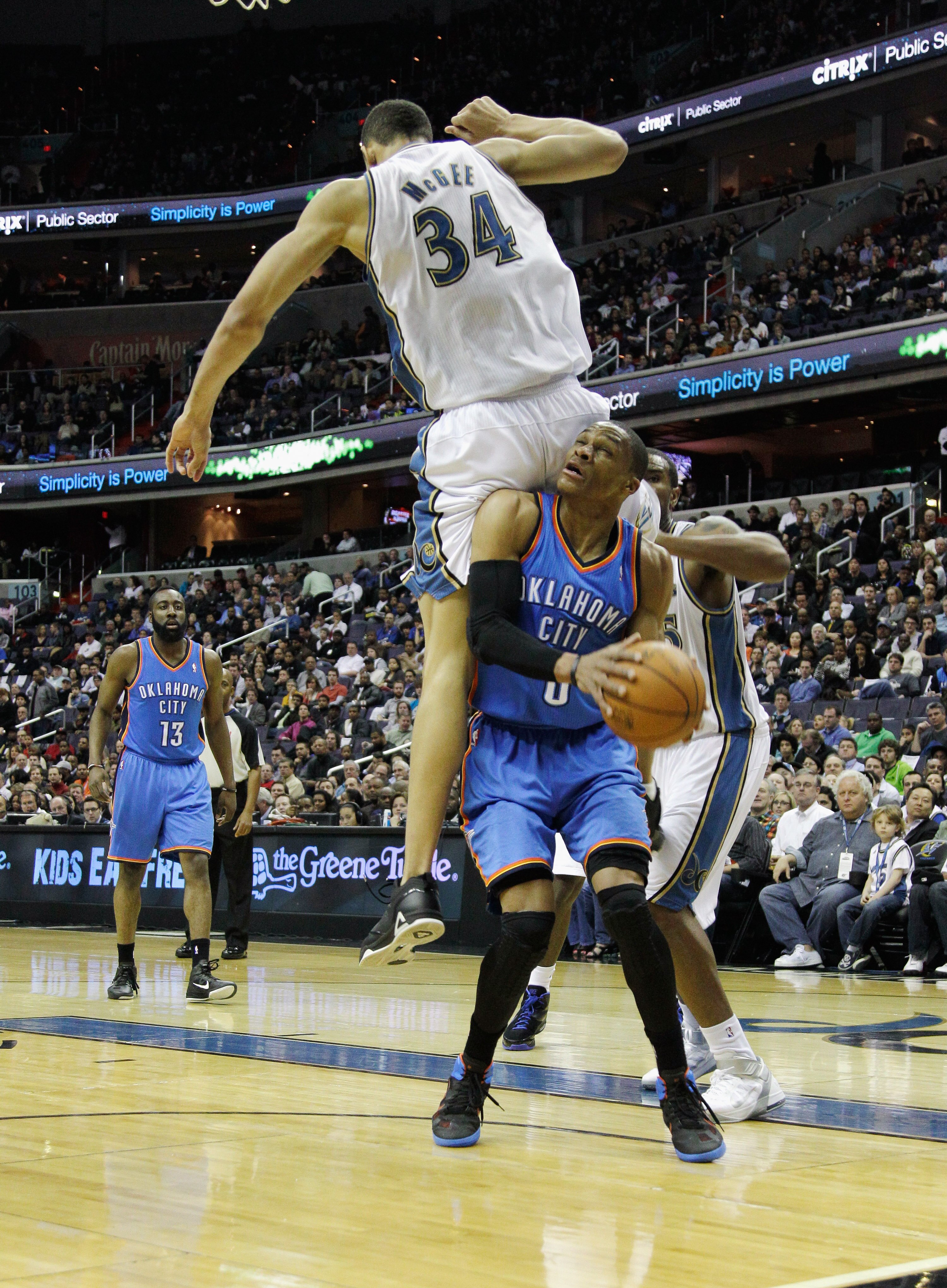 WASHINGTON, DC - MARCH 14:  Russell Westbrook #0 of the Oklahoma City Thunder puts up a shot in front of JaVale McGee #34 of the Washington Wizards during the first half at the Verizon Center on March 14, 2011 in Washington, DC. NOTE TO USER: User express
