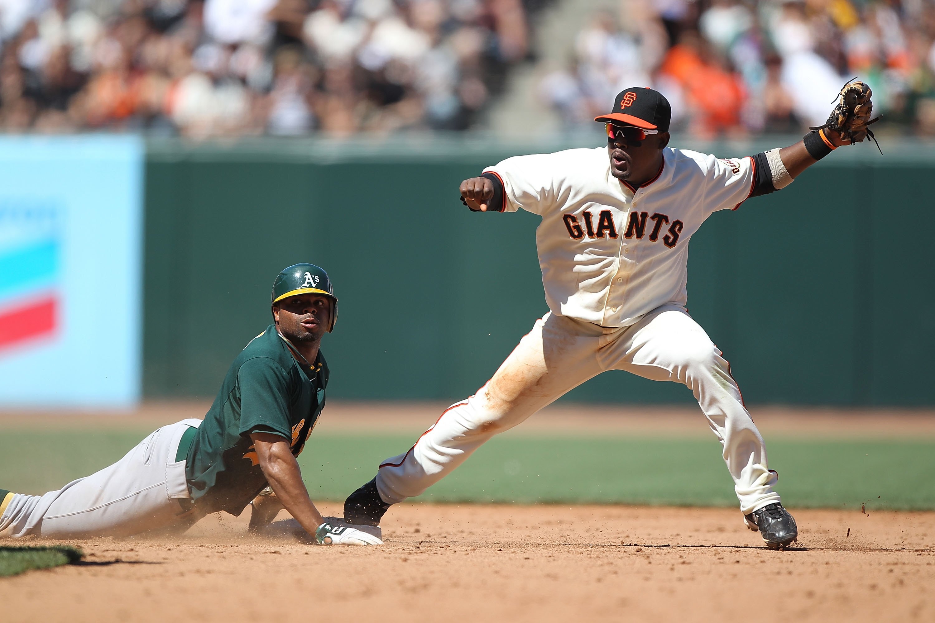 SAN FRANCISCO - JUNE 13:  Juan Uribe #5 of the San Francisco Giants tags out Rajai Davis #11 of the Oakland Athletics on a double play to end the game during an MLB game at AT&T Park on June 13, 2010 in San Francisco, California.  (Photo by Jed Jacobsohn/