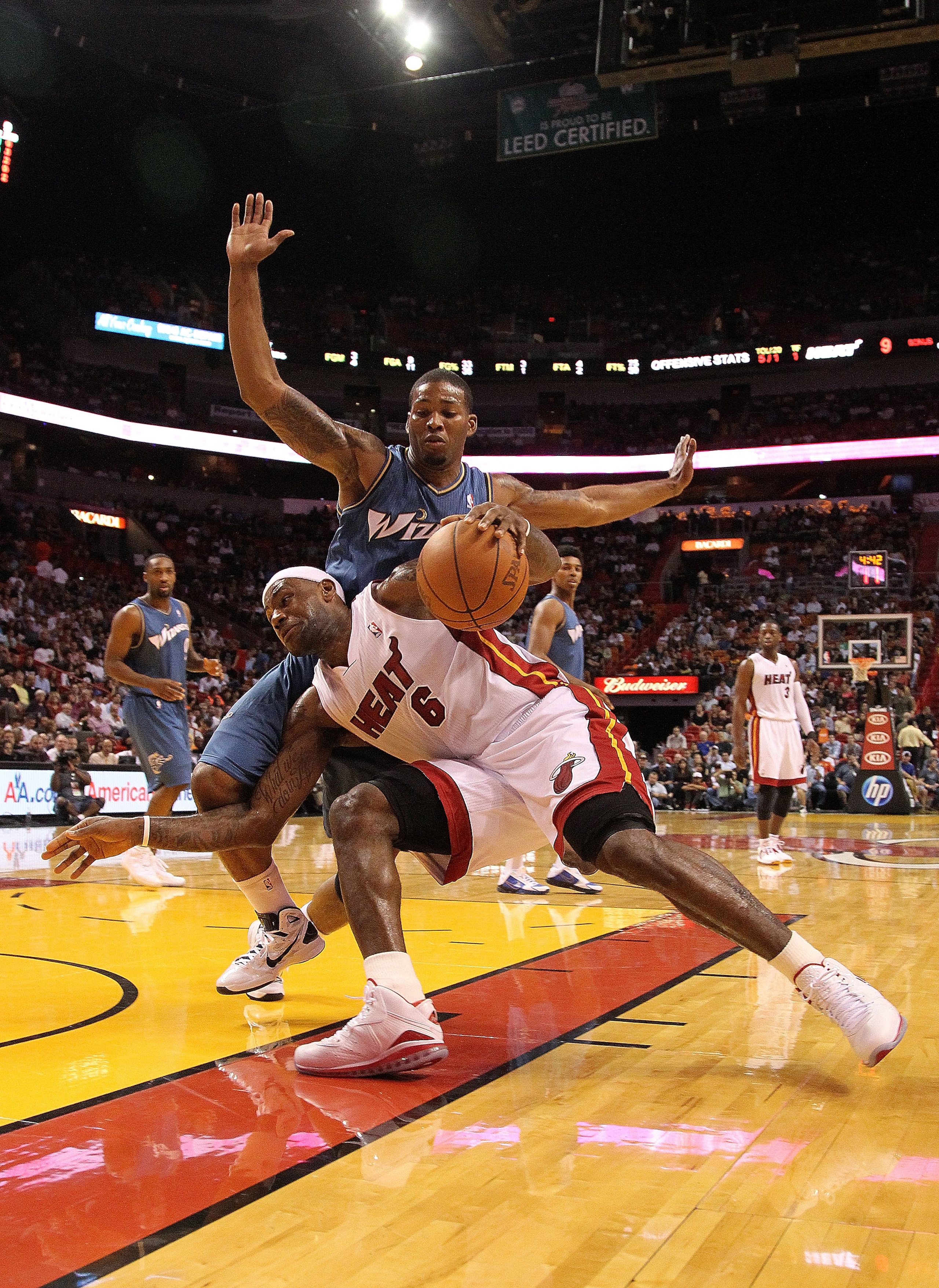 MIAMI, FL - NOVEMBER 29: LeBron James #6 of the Miami Heat dribbles around Kevin Seraphin #15 of the Washington Wizards during a game at American Airlines Arena on November 29, 2010 in Miami, Florida. NOTE TO USER: User expressly acknowledges and agrees MIAMI, FL - NOVEMBER 29: LeBron James #6 of the Miami Heat dribbles around Kevin Seraphin #15 of the Washington Wizards during a game at American Airlines Arena on November 29, 2010 in Miami, Florida. NOTE TO USER: User expressly acknowledges and agrees
