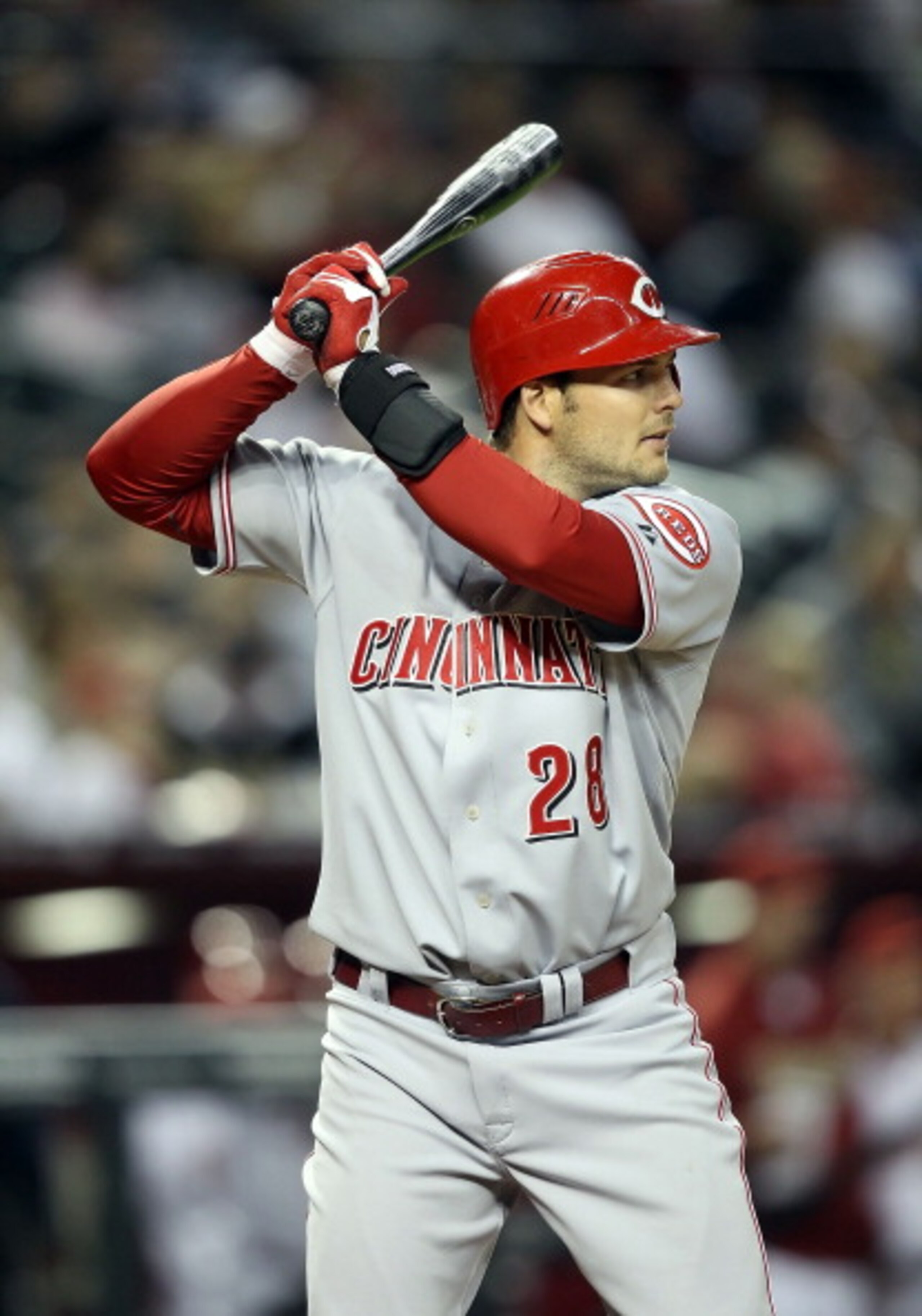 PHOENIX, AZ - APRIL 08:  Chris Heisey #28 of the Cincinnati Reds bats against the Arizona Diamondbacks during the Major League Baseball home opening game at Chase Field on April 8, 2011 in Phoenix, Arizona. The Diamondbacks defeated the Reds 13-2.  (Photo