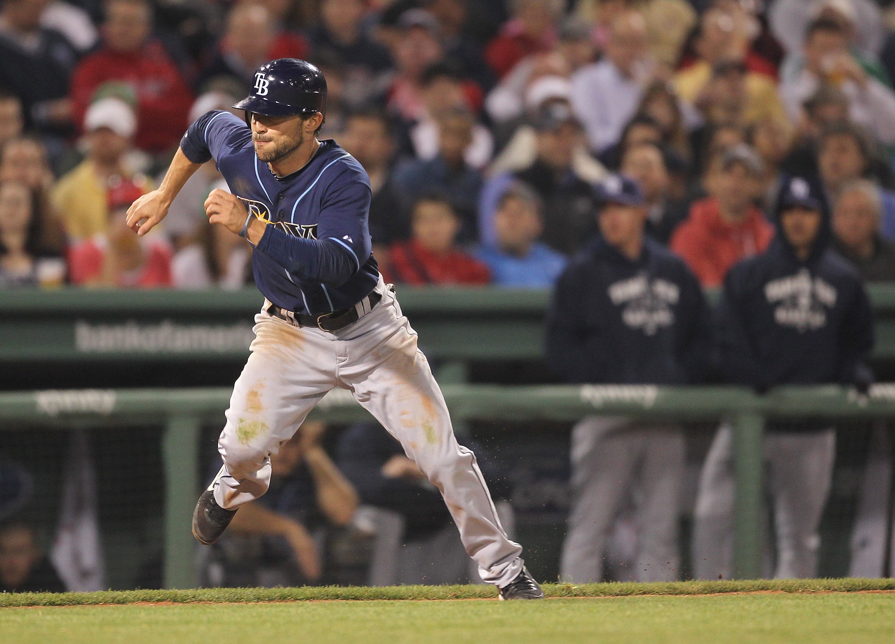 BOSTON, MA - APRIL 11:  Sam Fuld #5 of the Tampa Bay Rays scores on a wild pitch against the Boston Red Sox at Fenway Park April 11, 2011 in Boston, Massachusetts. (Photo by Jim Rogash/Getty Images)