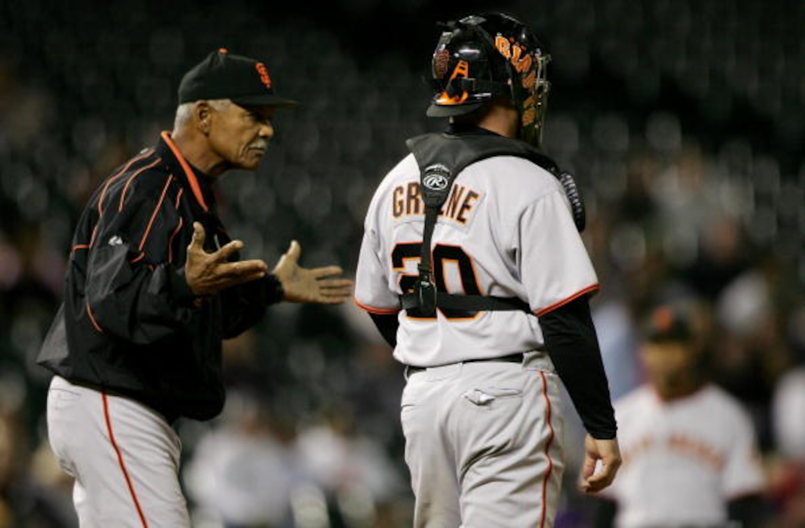 DENVER - SEPTEMBER 18: Manager Felipe Alou of the San Francisco Giants gestures as he and catcher Todd Greene #20 await a pitching change as Scott Munter left the game and Brian Wilson entered to face the Colorado Rockies in the third inning at Coors Fie DENVER - SEPTEMBER 18: Manager Felipe Alou of the San Francisco Giants gestures as he and catcher Todd Greene #20 await a pitching change as Scott Munter left the game and Brian Wilson entered to face the Colorado Rockies in the third inning at Coors Fie