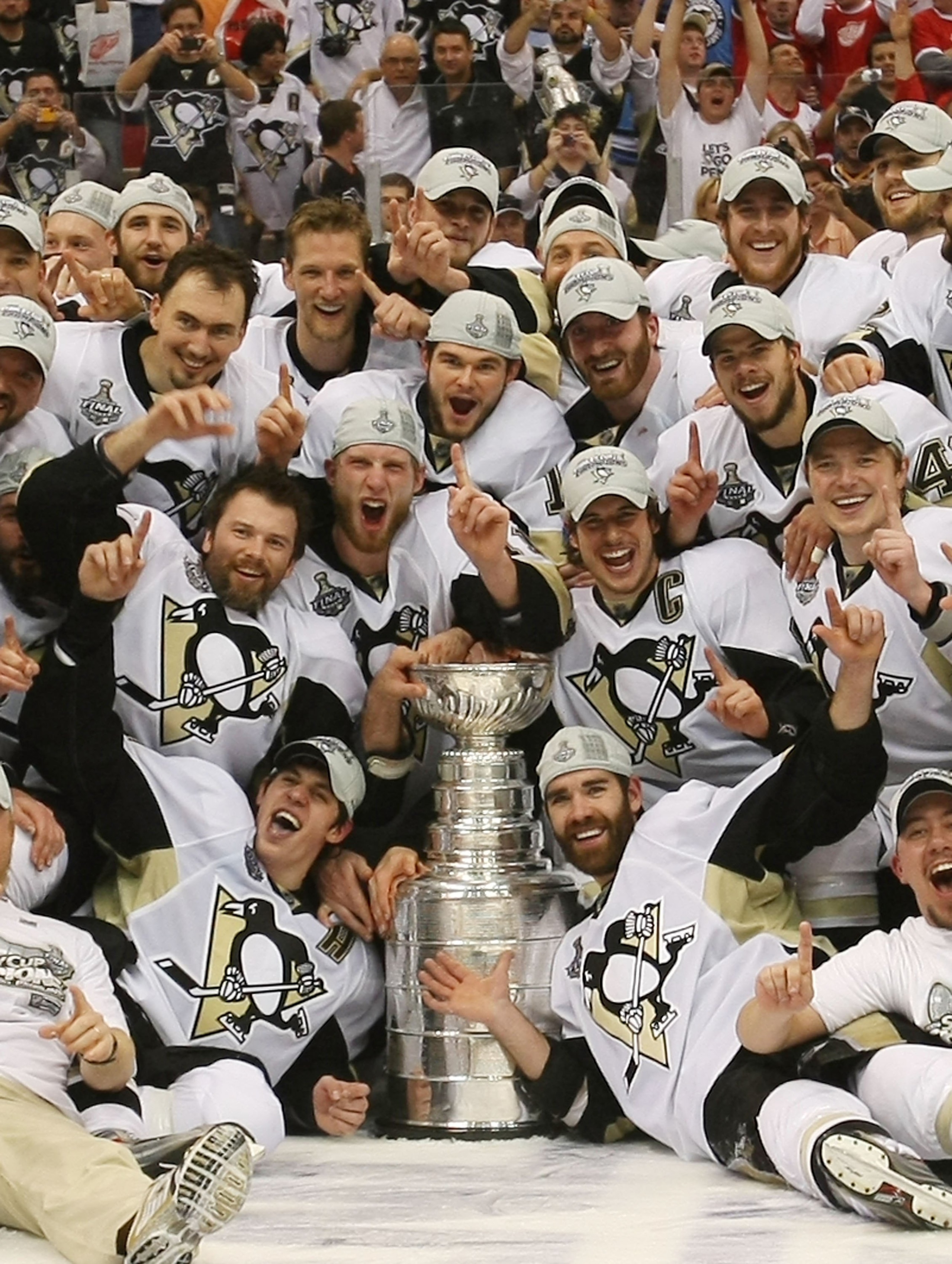 DETROIT - JUNE 12: The Pittsburgh Penguins celebrate with the Stanley Cup following the Penguins victory over the Detroit Red Wings in Game Seven of the 2009 NHL Stanley Cup Finals at Joe Louis Arena on June 12, 2009 in Detroit, Michigan. (Photo by Bruce DETROIT - JUNE 12: The Pittsburgh Penguins celebrate with the Stanley Cup following the Penguins victory over the Detroit Red Wings in Game Seven of the 2009 NHL Stanley Cup Finals at Joe Louis Arena on June 12, 2009 in Detroit, Michigan. (Photo by Bruce