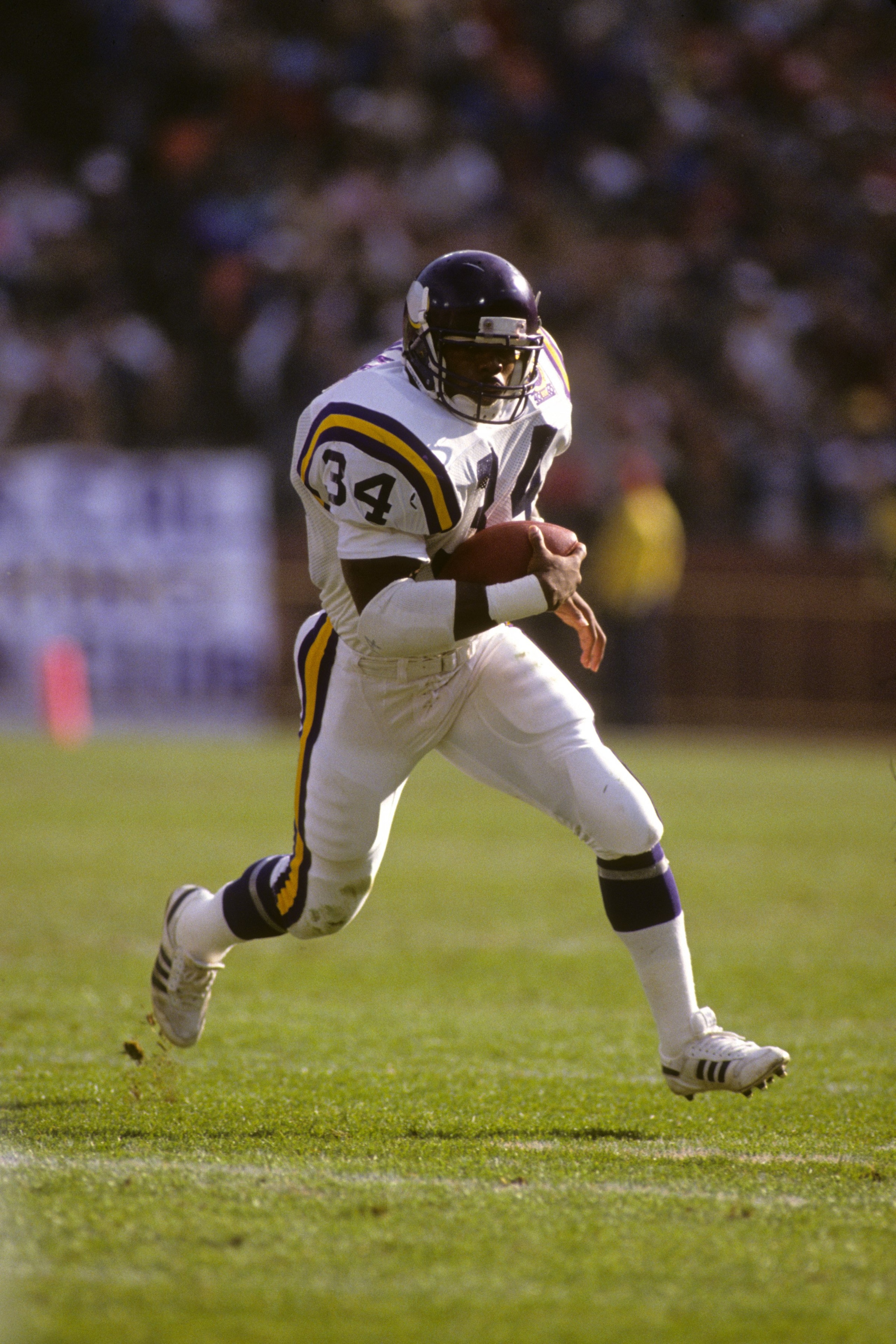 SAN FRANCISCO - JANUARY 6:  Running back Herschel Walker #34 of the Minnesota Vikings rushes for yards during the 1989 NFC Divisional Playoff game against the San Francisco 49ers at Candlestick Park on January 6, 1990 in San Francisco, California.  The 49