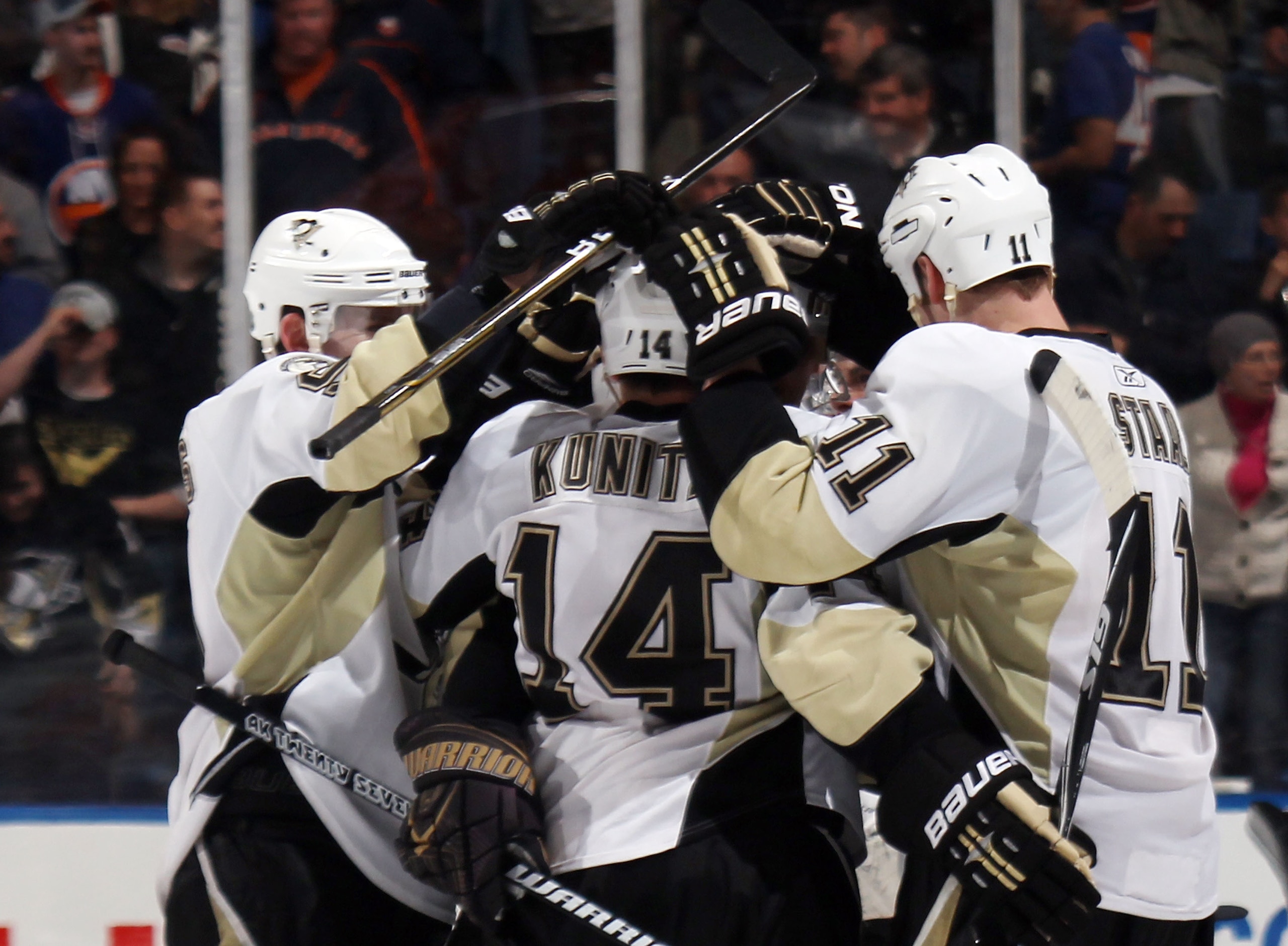 UNIONDALE, NY - APRIL 08: Chris Kunitz #14 and the Pittsburgh Penguins celebrate his shootout goal against the New York Islanders at the Nassau Coliseum on April 8, 2011 in Uniondale, New York. The Penguins defeated the Islanders 4-3 in the shoot out. (Ph UNIONDALE, NY - APRIL 08: Chris Kunitz #14 and the Pittsburgh Penguins celebrate his shootout goal against the New York Islanders at the Nassau Coliseum on April 8, 2011 in Uniondale, New York. The Penguins defeated the Islanders 4-3 in the shoot out. (Ph