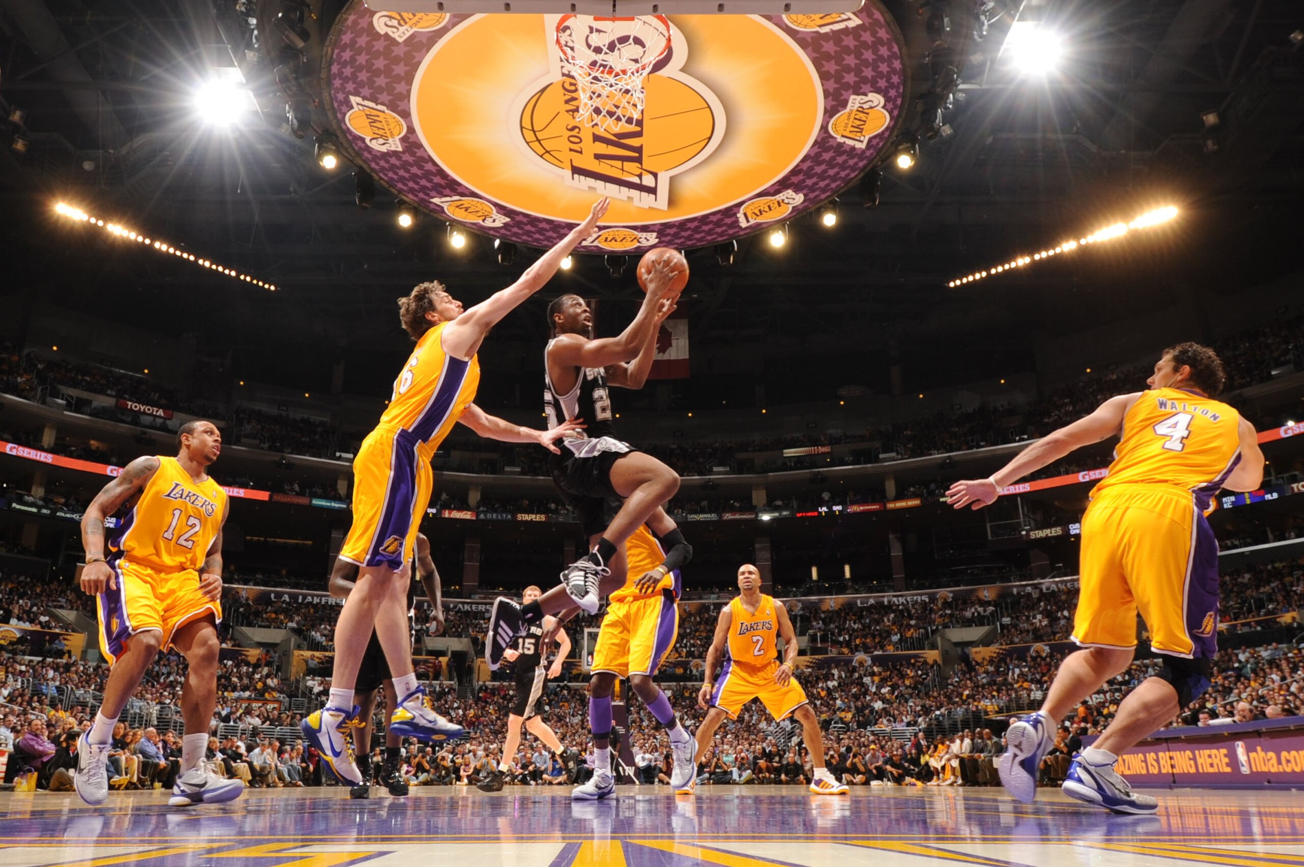 LOS ANGELES, CA - APRIL 12:  James Anderson #25 of the San Antonio Spurs goes up for a shot against Pau Gasol #16 of the Los Angeles Lakers at Staples Center on April 12, 2011 in Los Angeles, California. NOTE TO USER: User expressly acknowledges and agree
