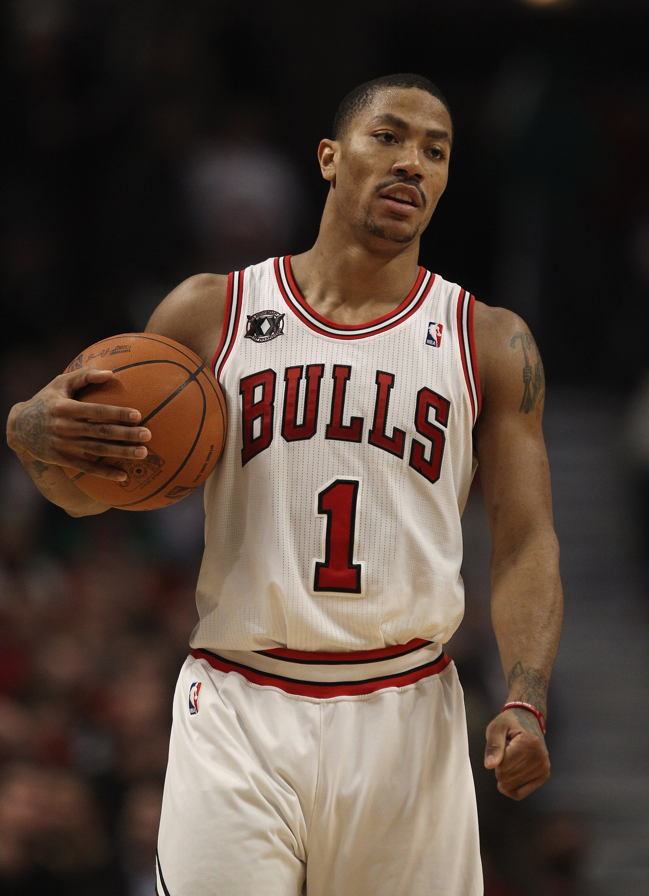 CHICAGO, IL - APRIL 07: Derrick Rose #1 of the Chicago Bulls holds the ball during a break in the action against the Boston Celtics at United Center on April 7, 2011 in Chicago, Illinois. The Bulls defeated the Celtics 97-81. NOTE TO USER: User expressly