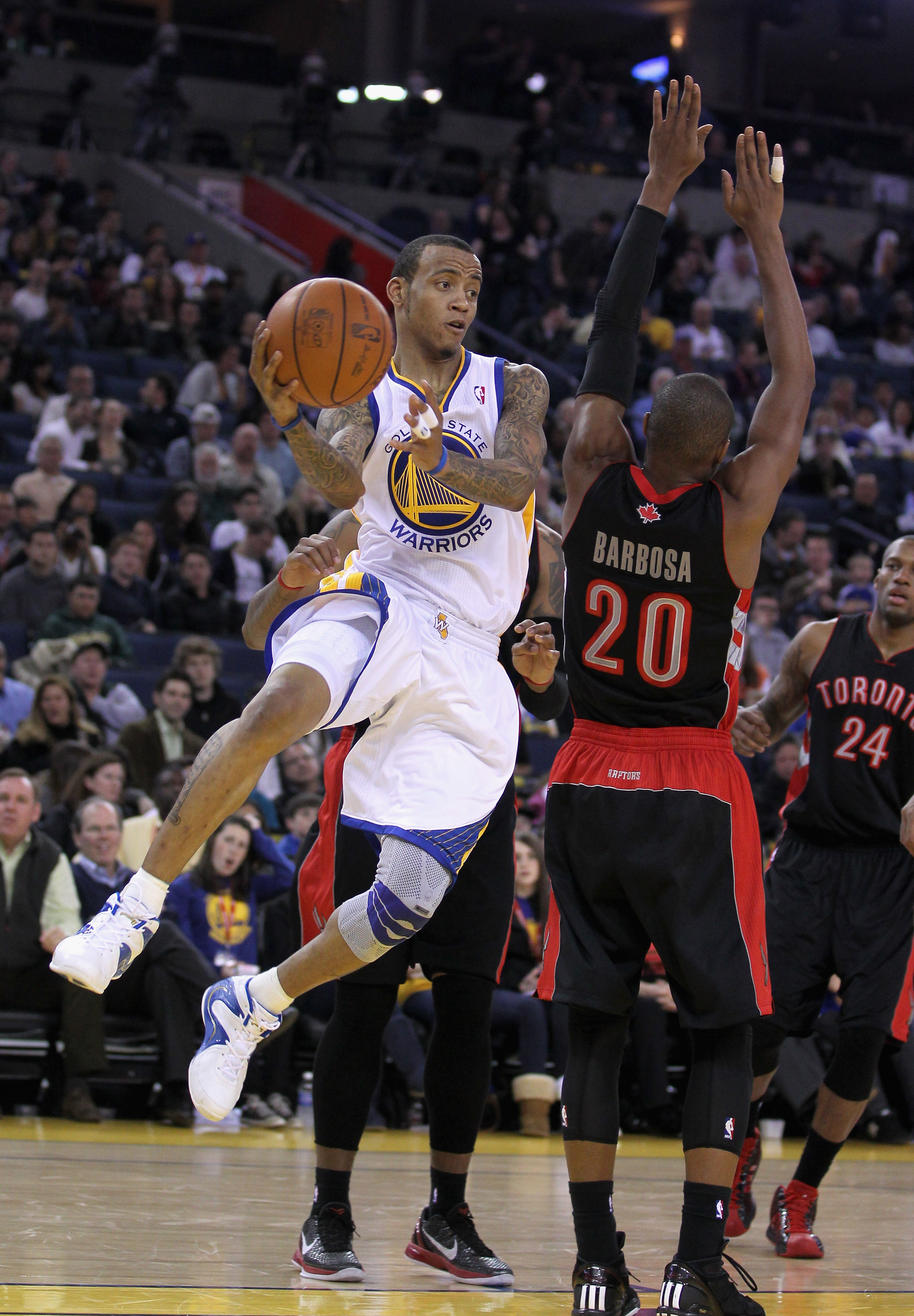 OAKLAND, CA - MARCH 25:  Monta Ellis #8 of the Golden State Warriors in action against the Toronto Raptors at Oracle Arena on March 25, 2011 in Oakland, California. NOTE TO USER: User expressly acknowledges and agrees that, by downloading and or using thi