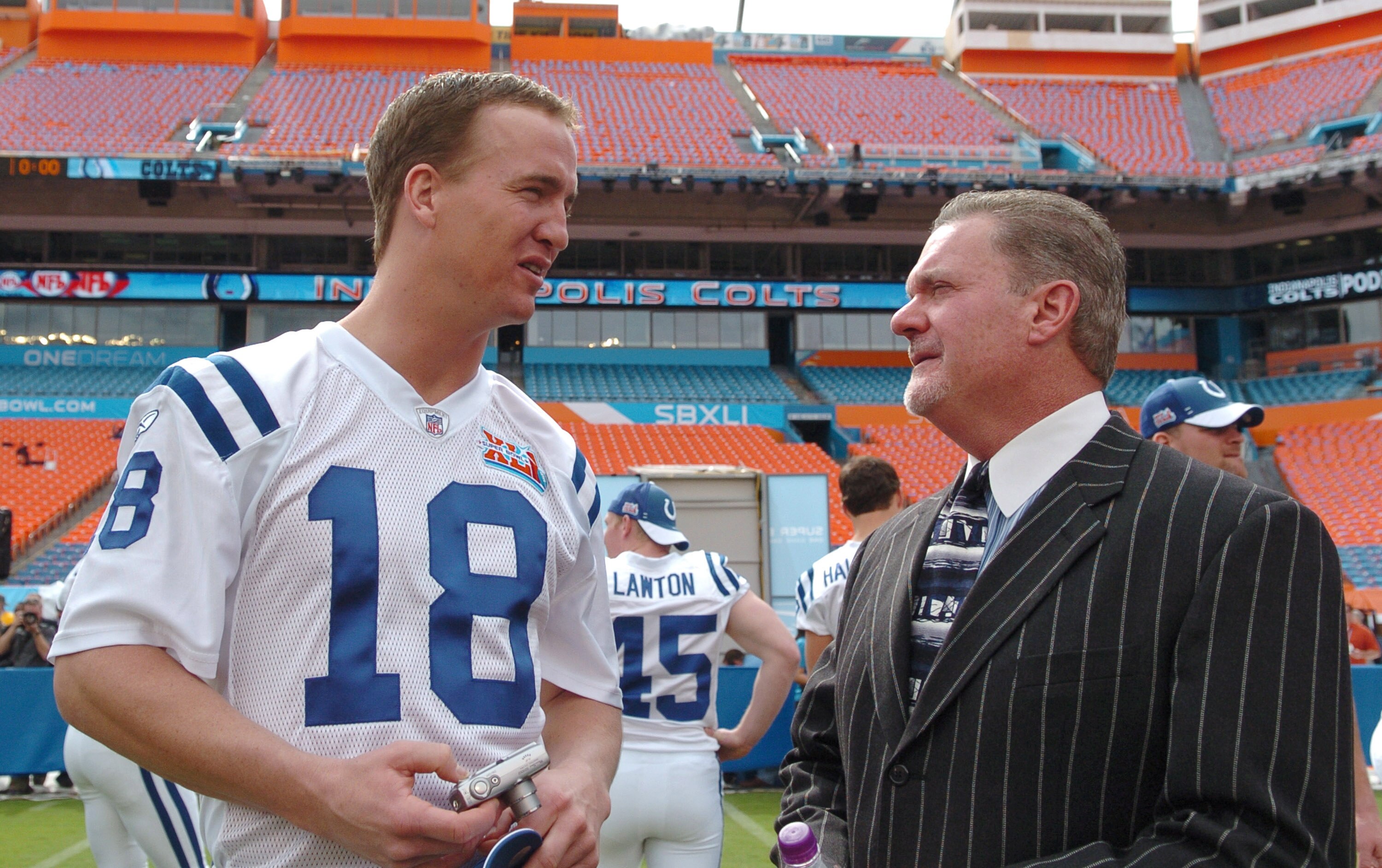 Peyton Manning of the Indianapolis Colts, left, talks with team owner Jim Irsay during Media Day prior to Super Bowl XLI at Dolphins Stadium in Miami, Florida on January 30, 2007. (Photo by A. Messerschmidt/Getty Images)