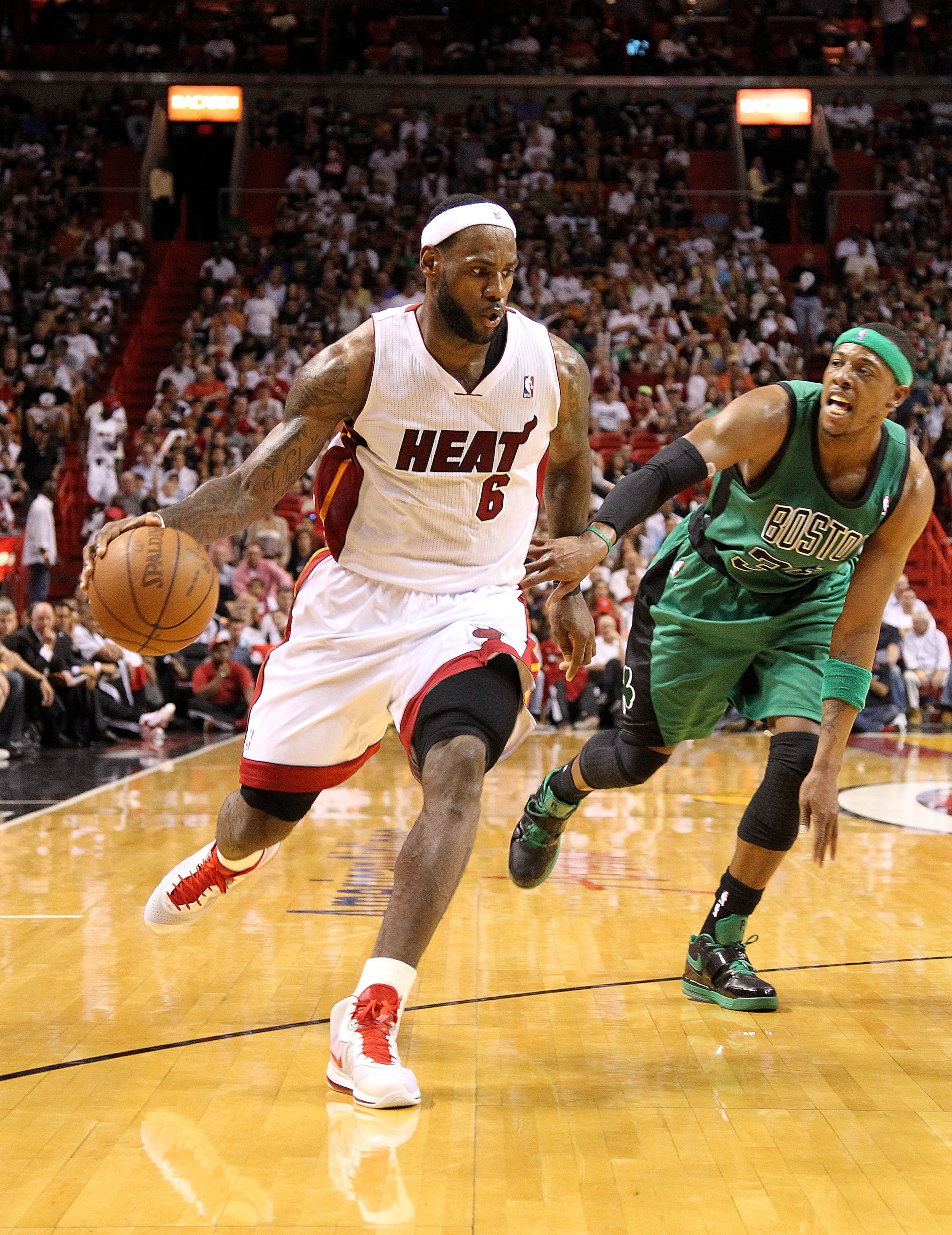 MIAMI, FL - APRIL 10:  LeBron James #6 of the Miami Heat posts up Paul Pierce #34 of the Boston Celtics during a game  at American Airlines Arena on April 10, 2011 in Miami, Florida. NOTE TO USER: User expressly acknowledges and agrees that, by downloadin