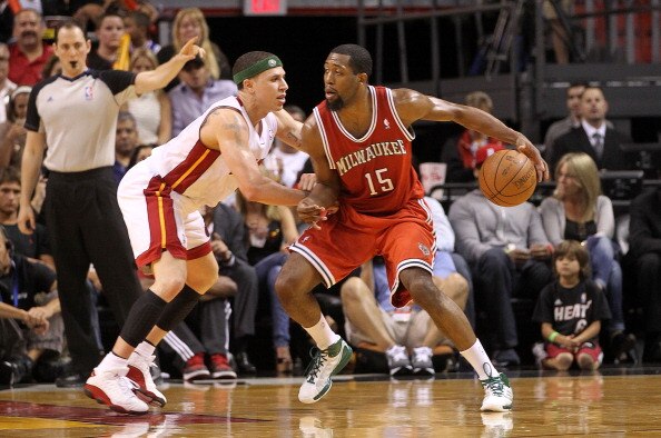 MIAMI, FL - APRIL 06:  John Salmons #15 of the Milwaukee Bucks posts up Mike Bibby #0 of the Miami Heat during a game at American Airlines Arena on April 6, 2011 in Miami, Florida. NOTE TO USER: User expressly acknowledges and agrees that, by downloading