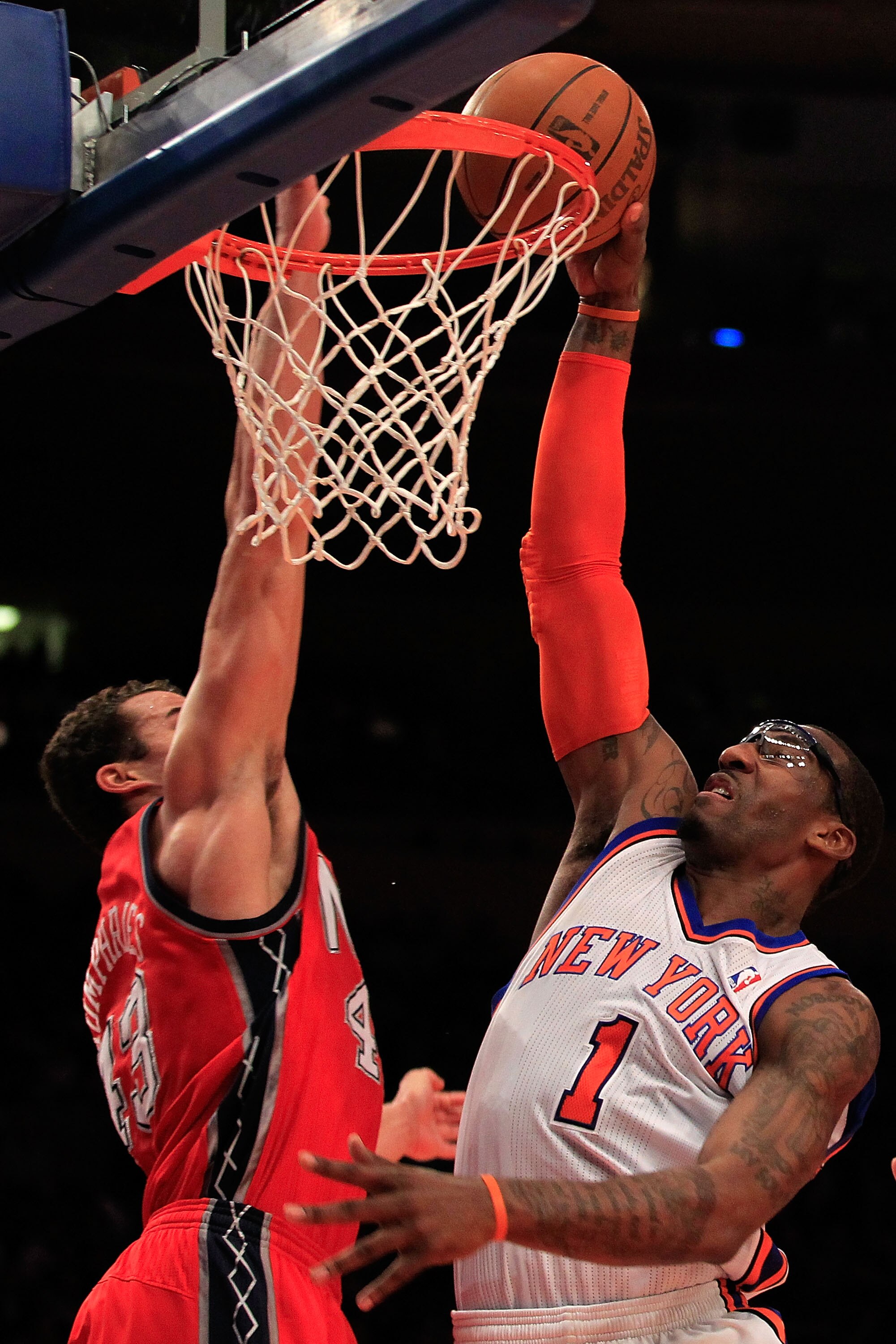 NEW YORK, NY - MARCH 30:  Amar'e Stoudemire #1 of the New York Knicks shoots over Kris Humphries #43 of the New Jersey Nets at Madison Square Garden on March 30, 2011 in New York City. NOTE TO USER: User expressly acknowledges and agrees that, by download