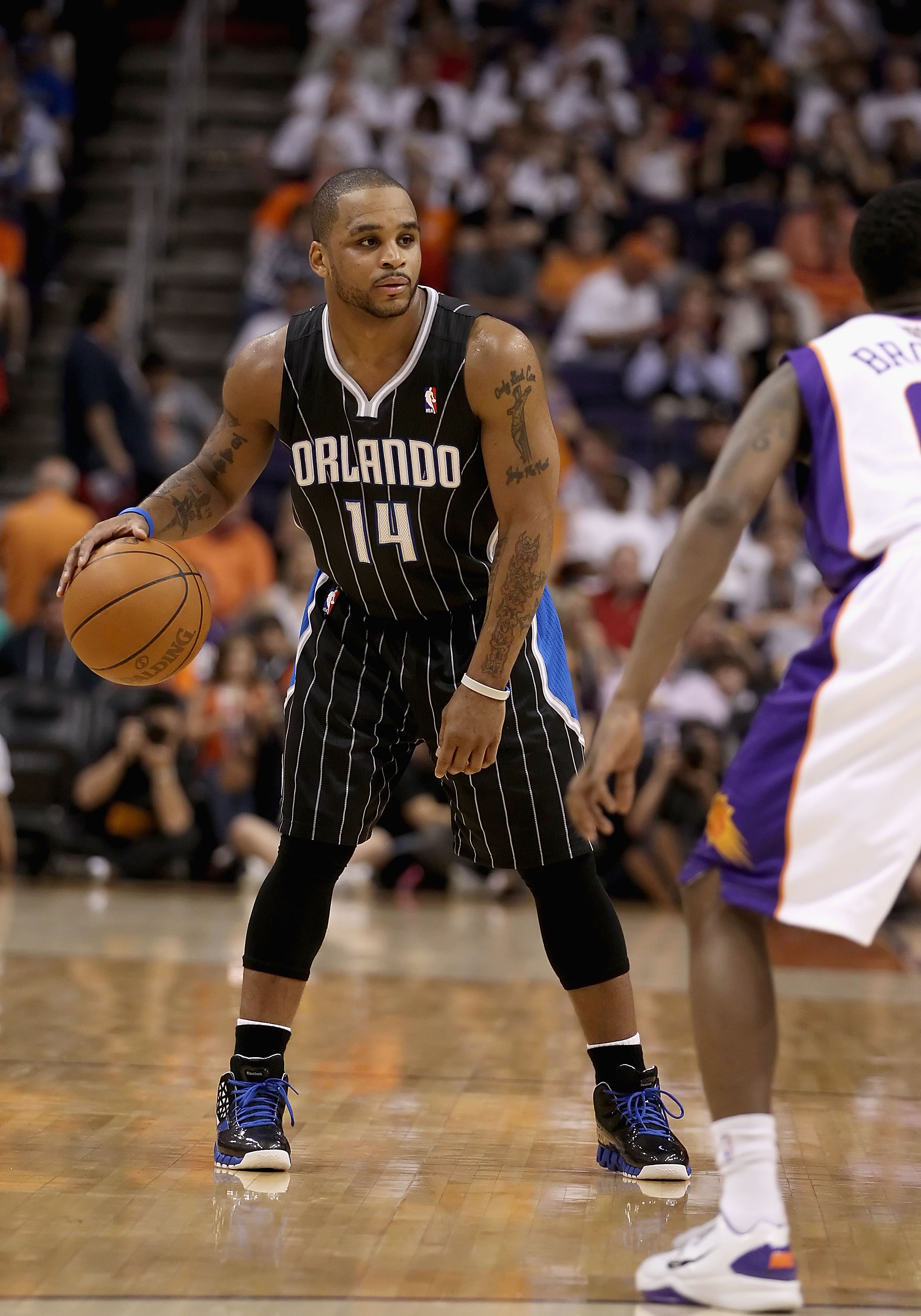 PHOENIX, AZ - MARCH 13:  Jameer Nelson #14 of the Orlando Magic handles the ball during the NBA game against the Phoenix Suns at US Airways Center on March 13, 2011 in Phoenix, Arizona. The Magic defeated the Suns 111-88. NOTE TO USER: User expressly ackn