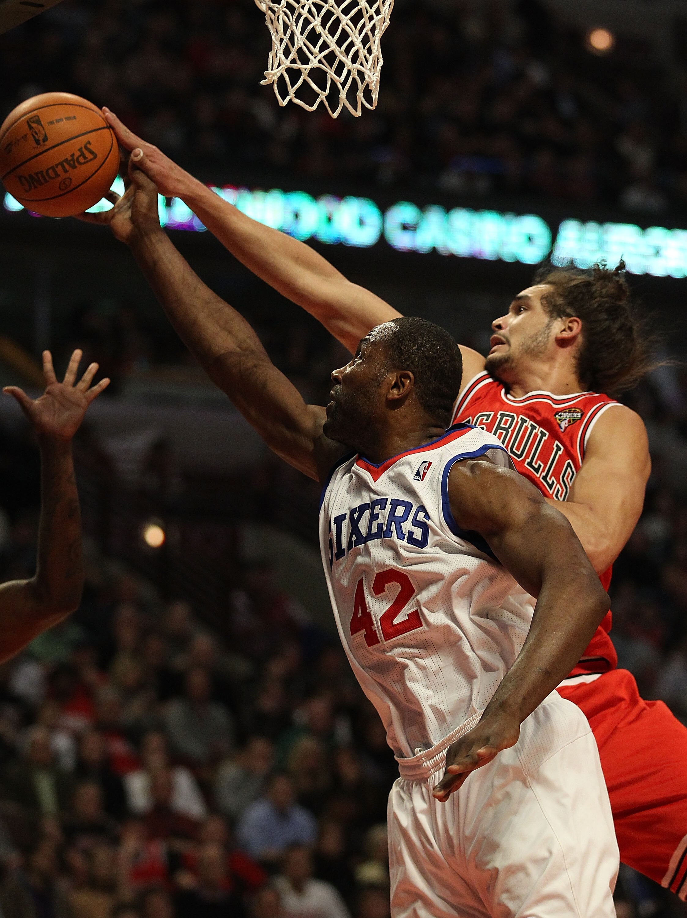 CHICAGO, IL - MARCH 28: Elton Brand #42 of the Philadelphia 76ers and Joakim Noah #13 of the Chicago Bulls reach for a rebound at the United Center on March 28, 2011 in Chicago, Illinois. NOTE TO USER: User expressly acknowledges and agrees that, by downl