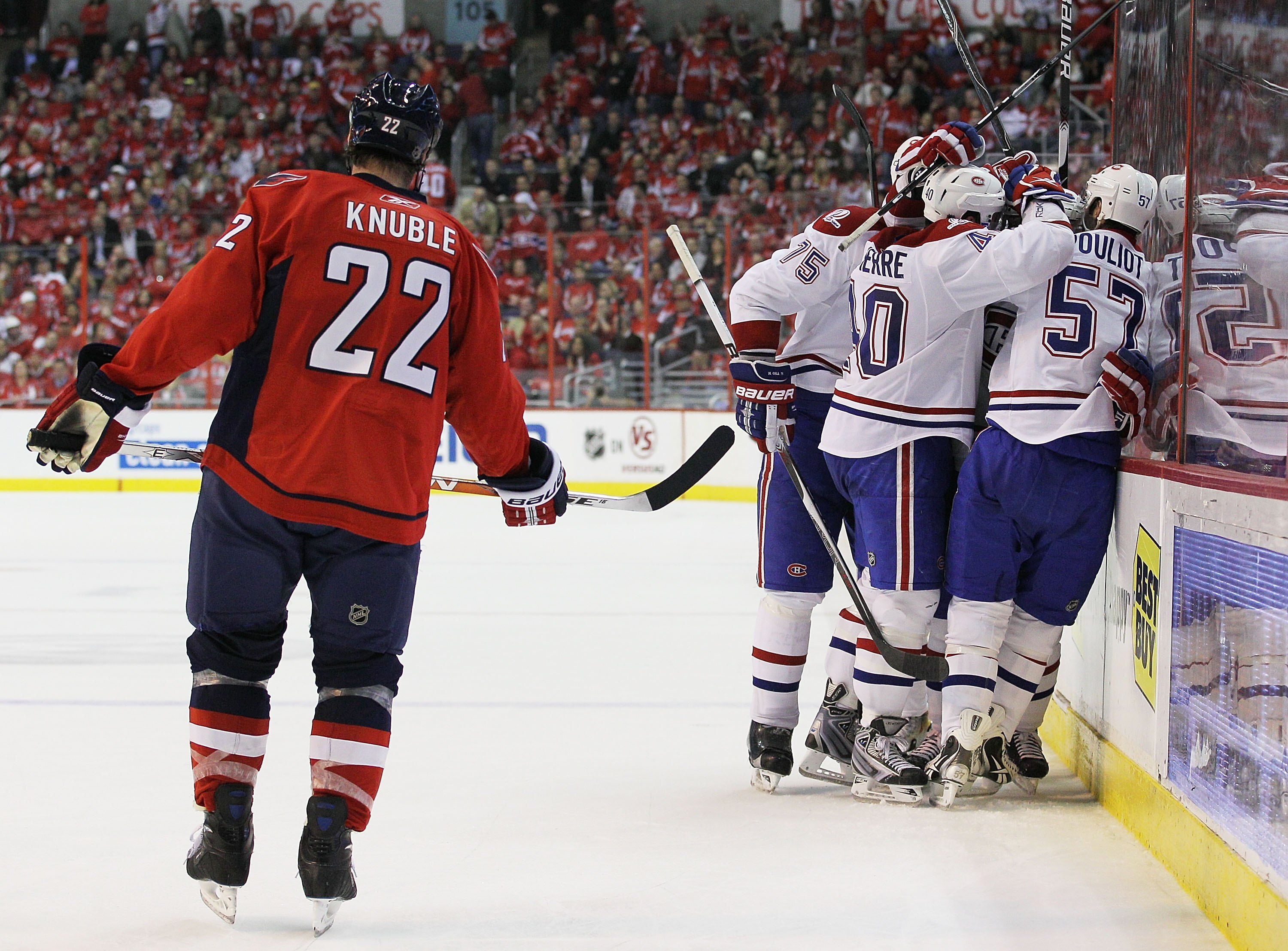 WASHINGTON - APRIL 28: Dominic Moore #42 of the Montreal Canadiens is surrounded by teammates after scoring the game winning goal in the third period against the Washington Capitals in Game Seven of the Eastern Conference Quarterfinals during the 2010 NHL