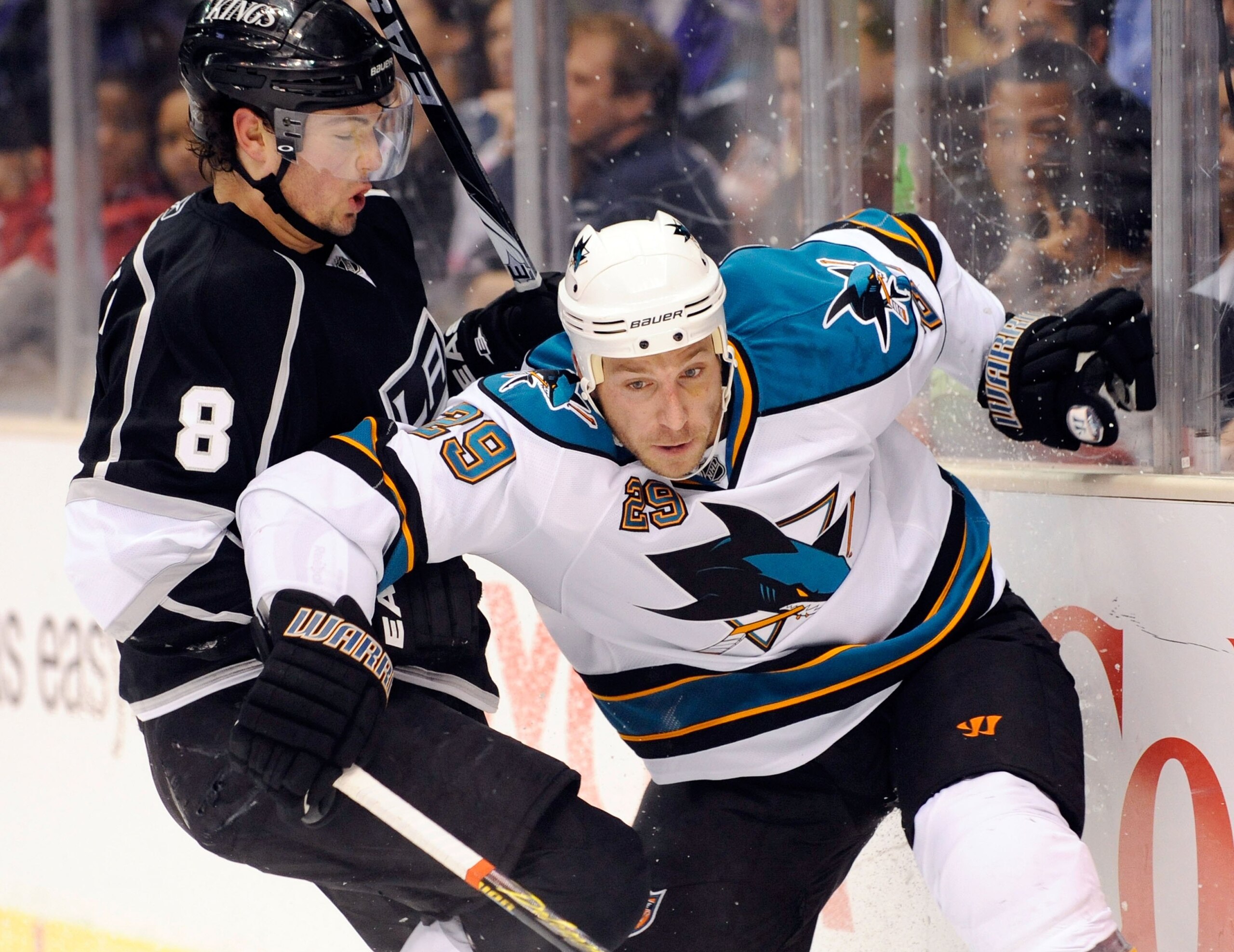 LOS ANGELES, CA - OCTOBER 06:  Ryane Clowe #29 of the San Jose Sharks moves for the puck against Drew Doughty #8 of the Los Angeles Kings during the NHL hockey game on October 6, 2009 in Los Angeles, California. Kings won, 6-4.  (Photo by Kevork Djansezia