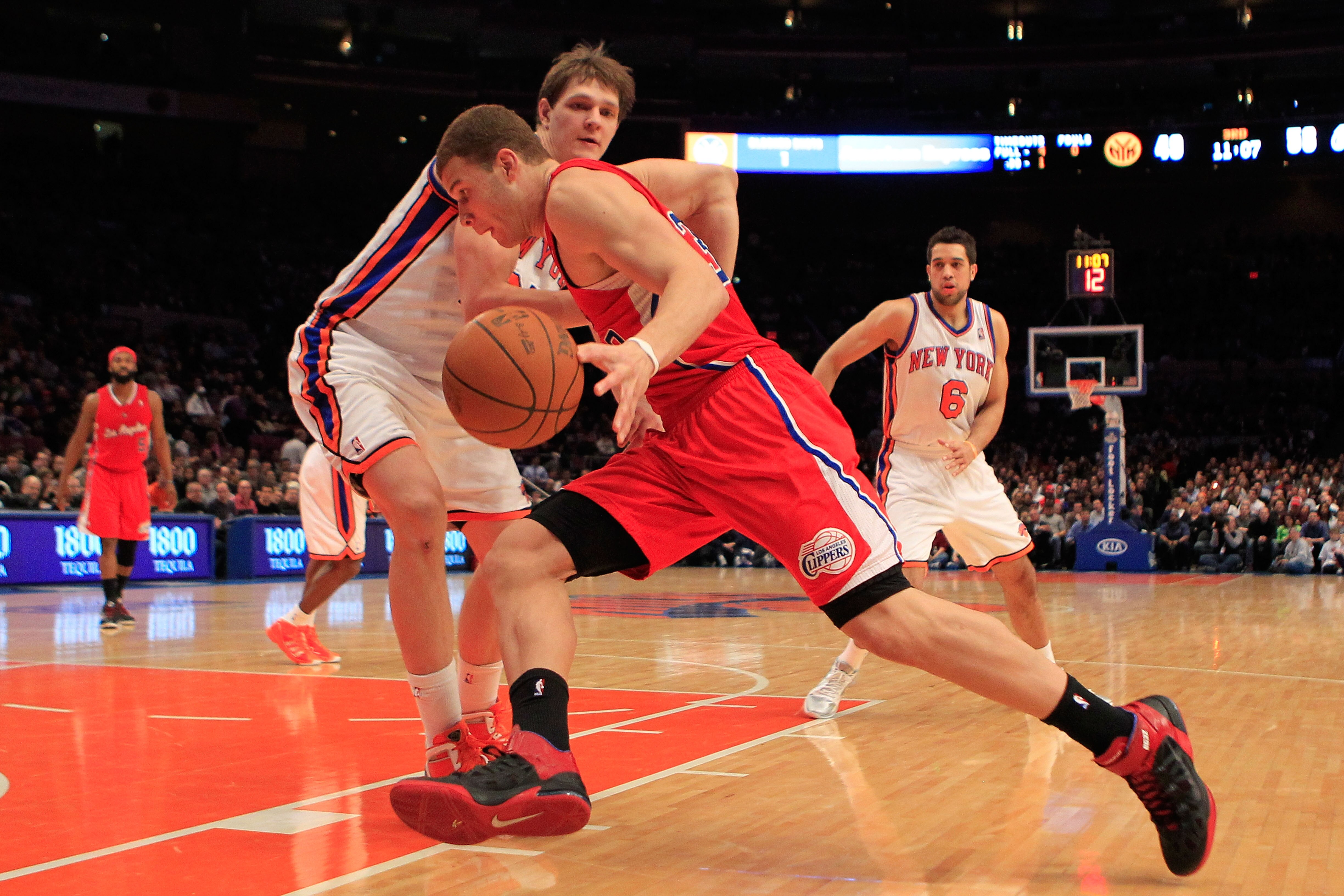 NEW YORK, NY - FEBRUARY 09: Blake Griffin #32 of the Los Angeles Clippers drives against Timofey Mozgov #25 of the New York Knicks at Madison Square Garden on February 9, 2011 in New York City. NOTE TO USER: User expressly acknowledges and agrees that, by