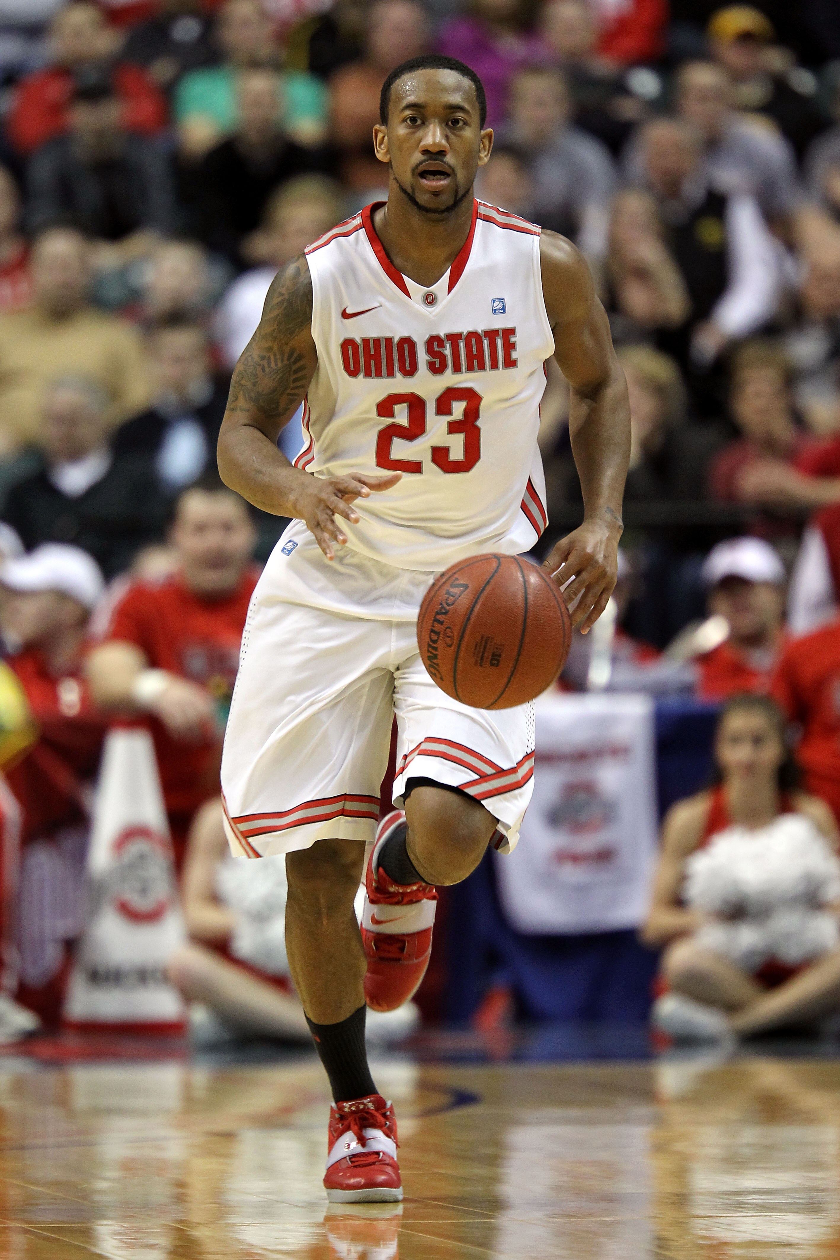 INDIANAPOLIS, IN - MARCH 12:  David Lighty #23 of the Ohio State Buckeyes brings the ball up court against the Michigan Wolverines during the semifinals of the 2011 Big Ten Men's Basketball Tournament at Conseco Fieldhouse on March 12, 2011 in Indianapoli